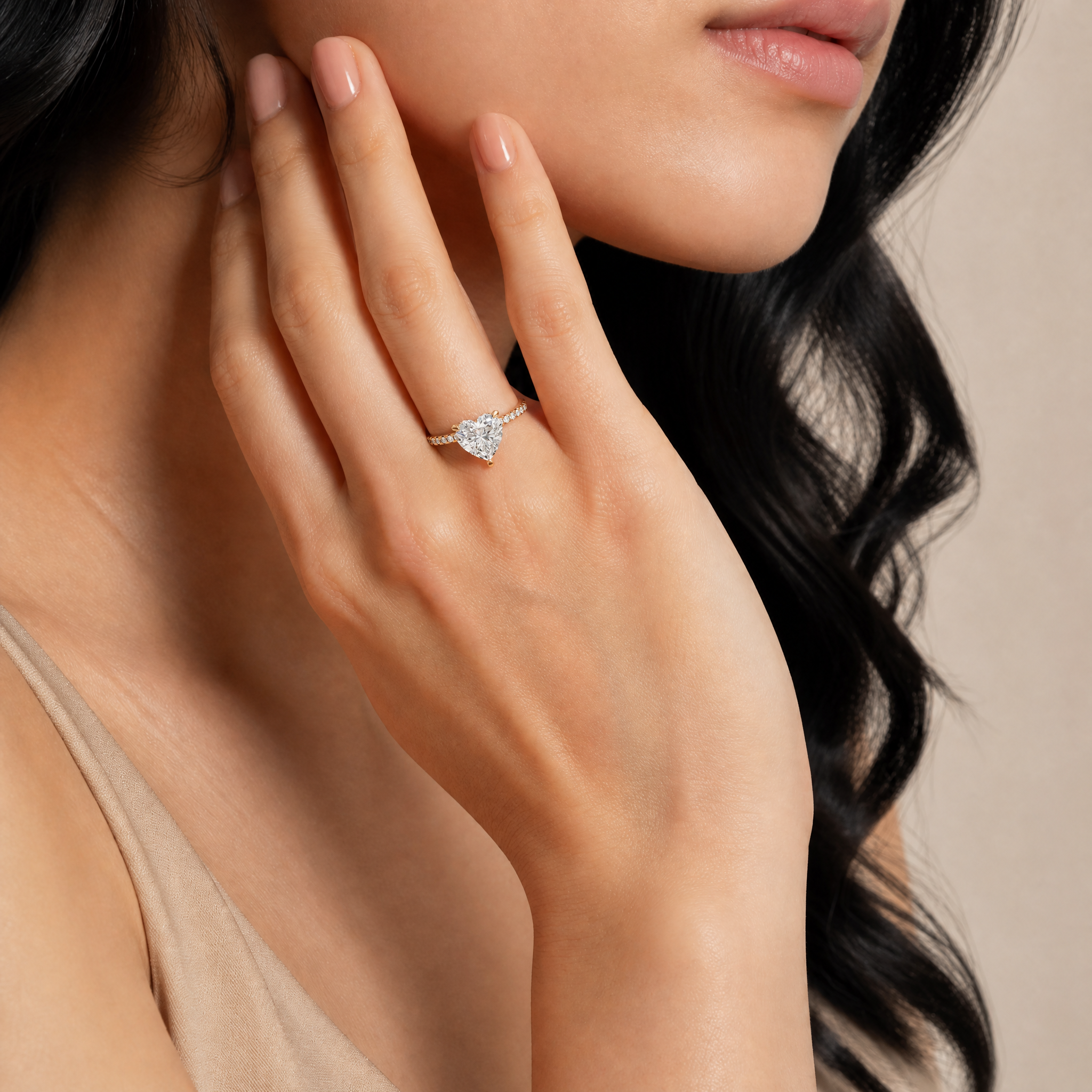 Elegant Model Wearing Heart Shape Lab Grown Diamond Engagement Ring in 14K Yellow Gold – Raul Diamonds