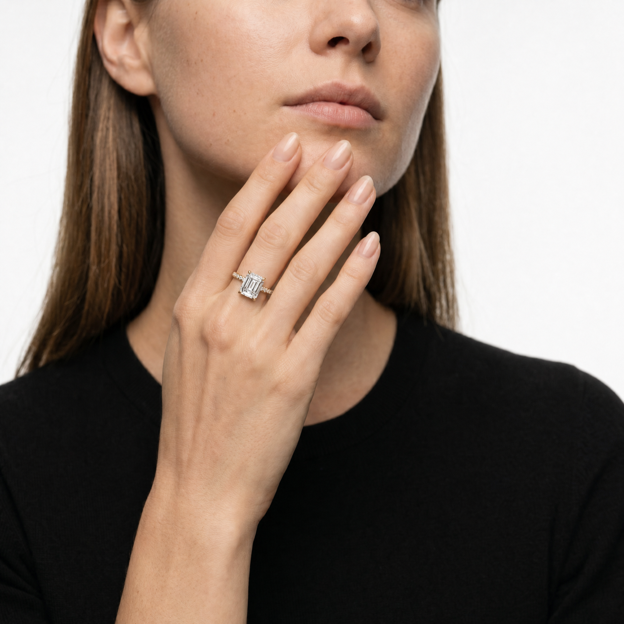 Luxury Model Wearing Emerald Cut Lab Grown Diamond Engagement Ring in 14K Yellow Gold – Raul Diamonds