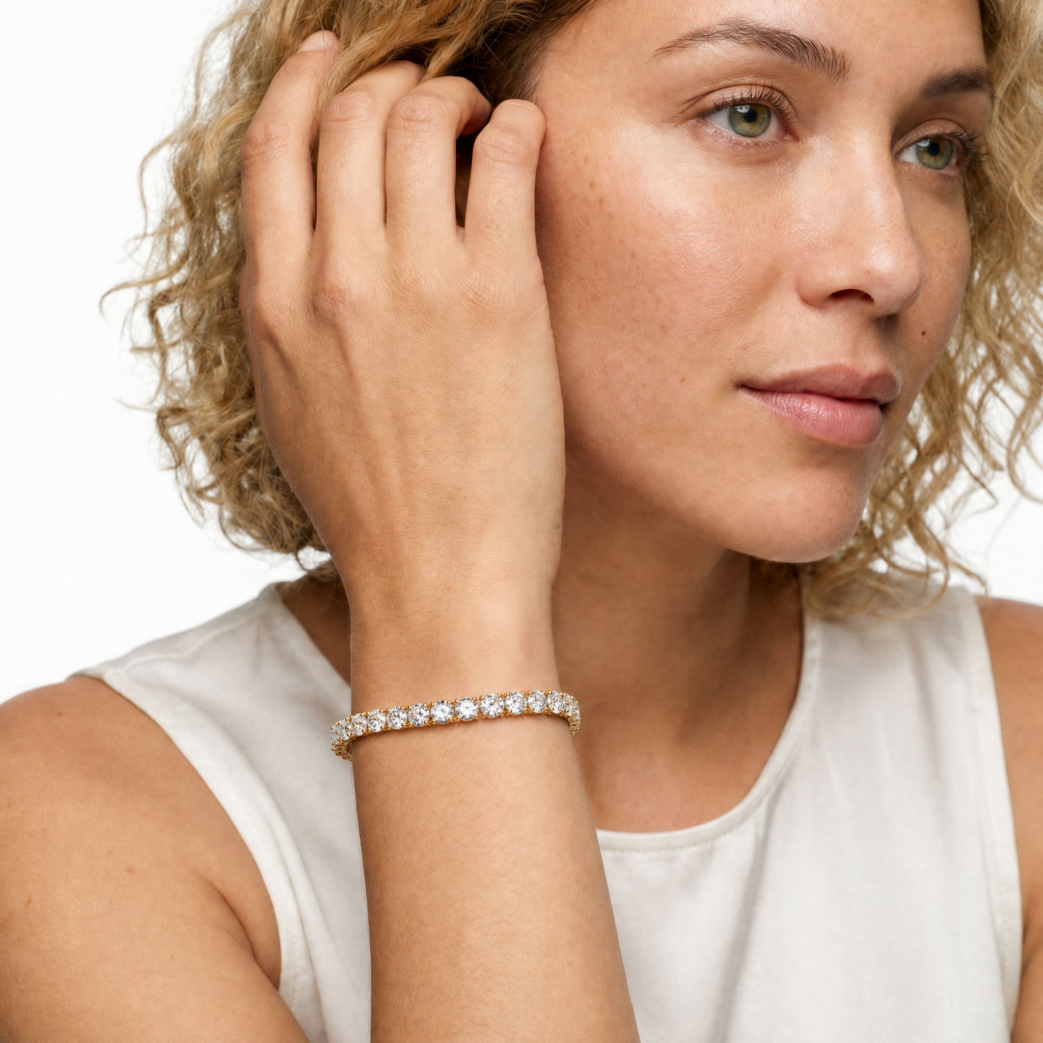 Elegant female model wearing a 14 carat lab grown diamond tennis bracelet by Raul Diamonds, showcasing luxury fine jewelry styling, timeless sophistication, and extraordinary diamond brilliance.