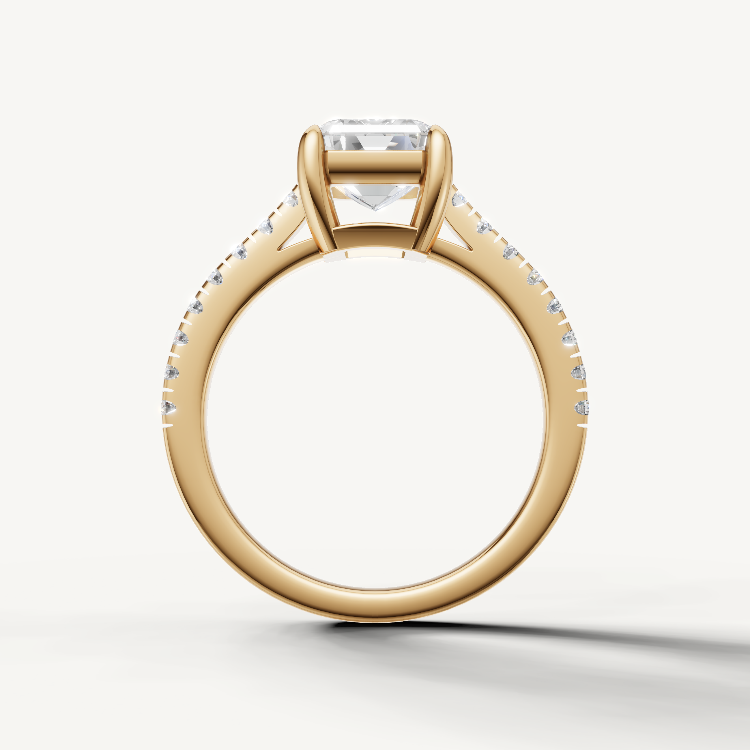 Elegant emerald cut lab grown diamond ring in yellow gold with pavé set diamonds