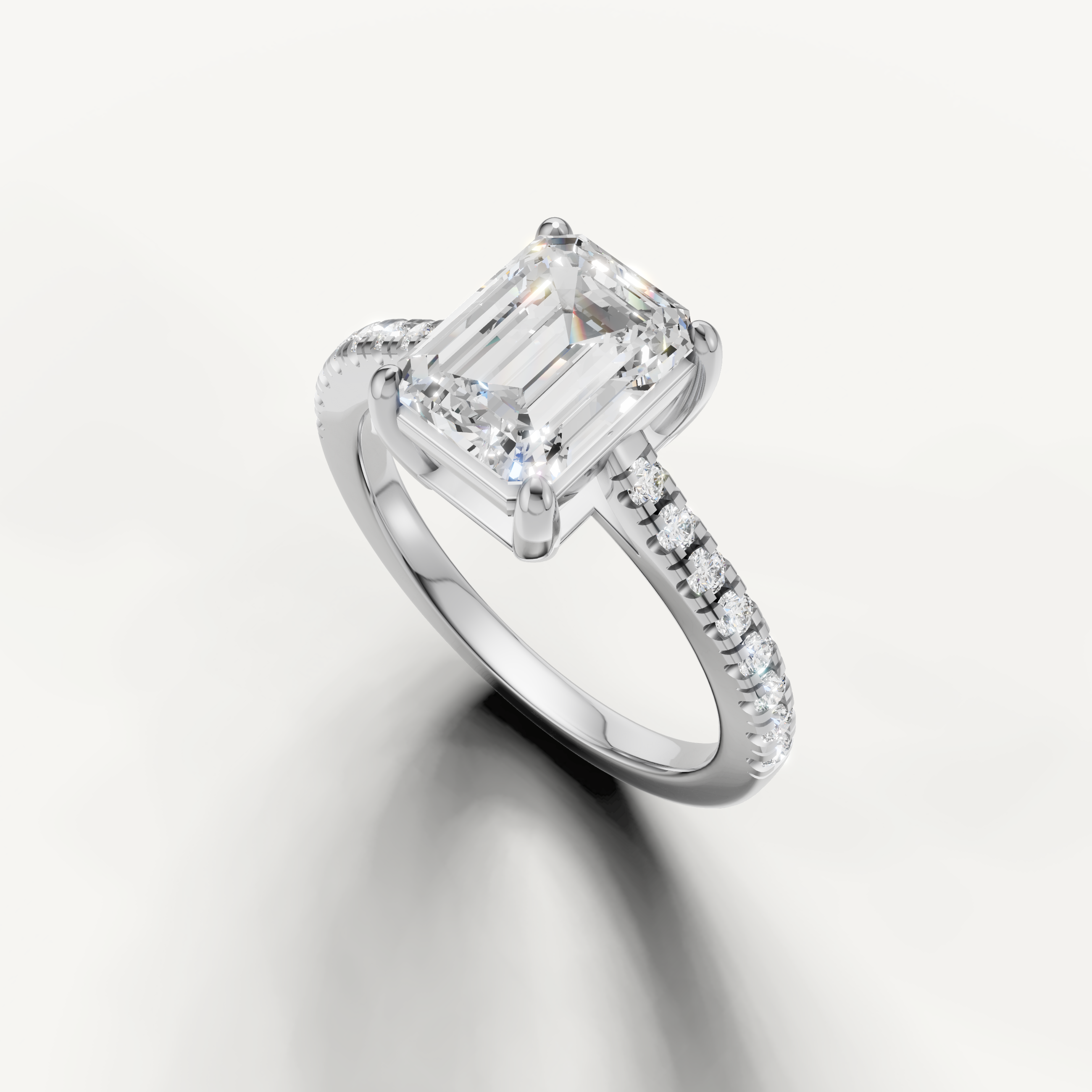 Timeless emerald cut lab grown diamond solitaire ring in white gold with pavé band