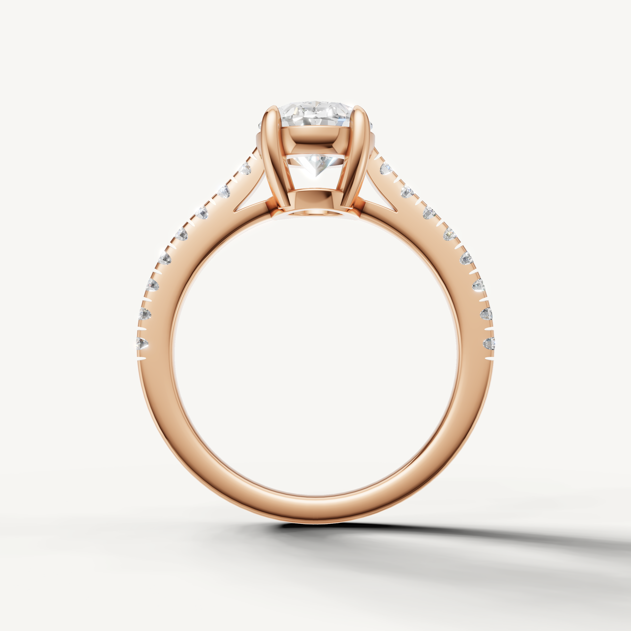 Classic oval lab grown diamond ring in rose gold with pavé diamonds