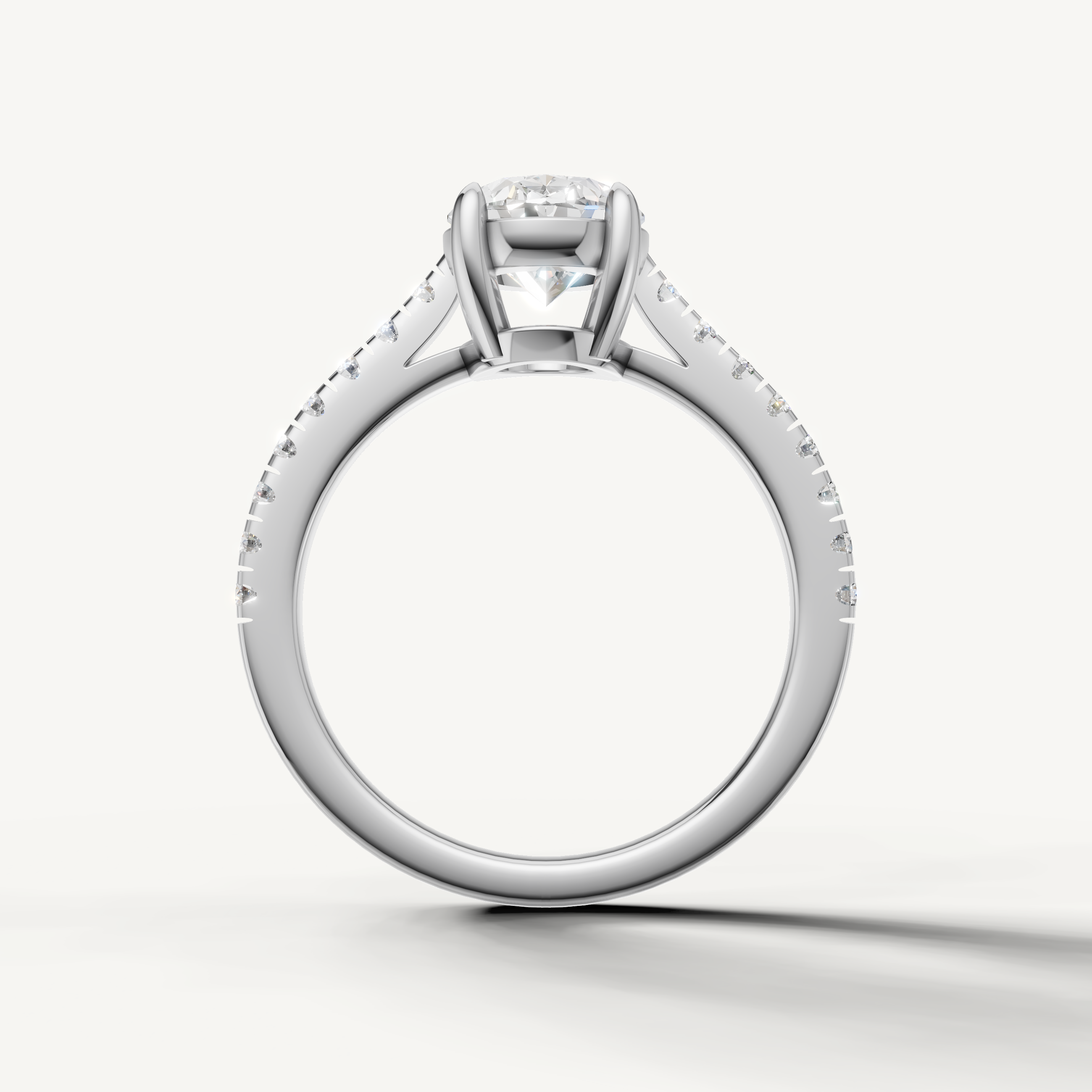 Classic oval lab grown diamond solitaire ring in white gold with pavé diamonds