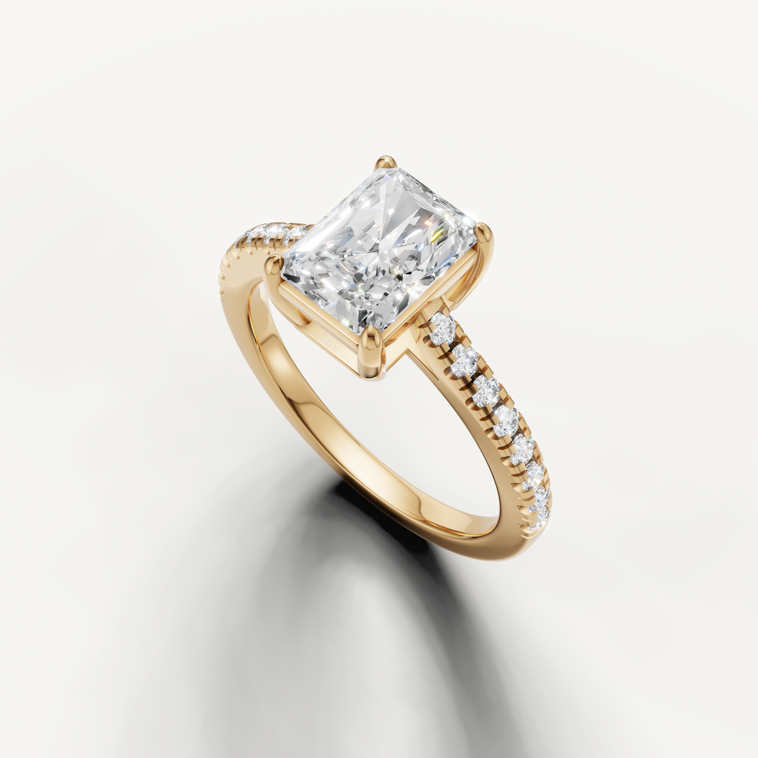 Elongated radiant cut lab diamond ring in yellow gold with pavé band