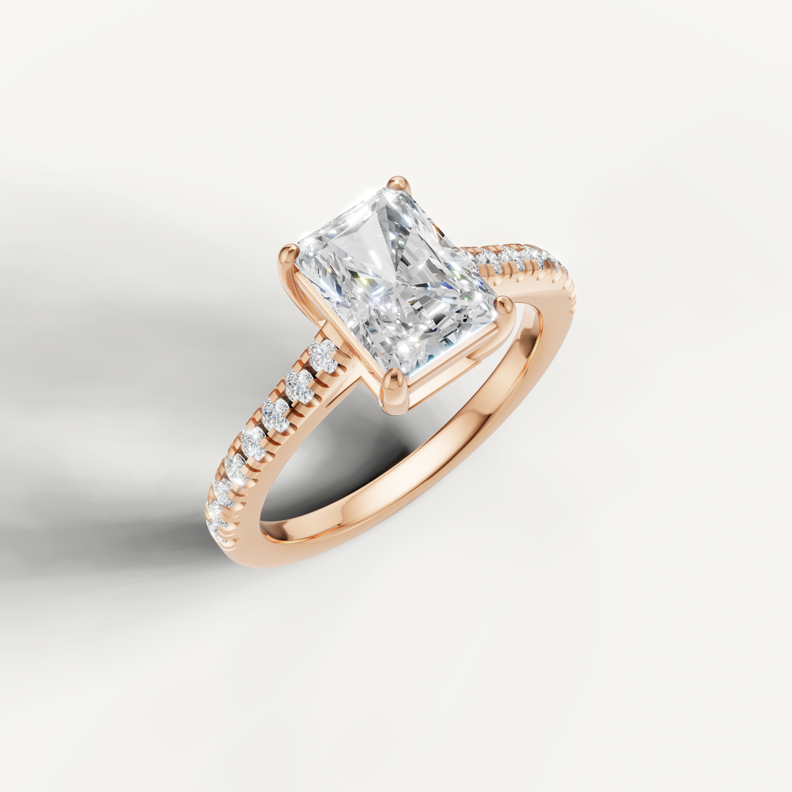 14K rose gold radiant cut diamond ring with micro pavé setting and elegant design