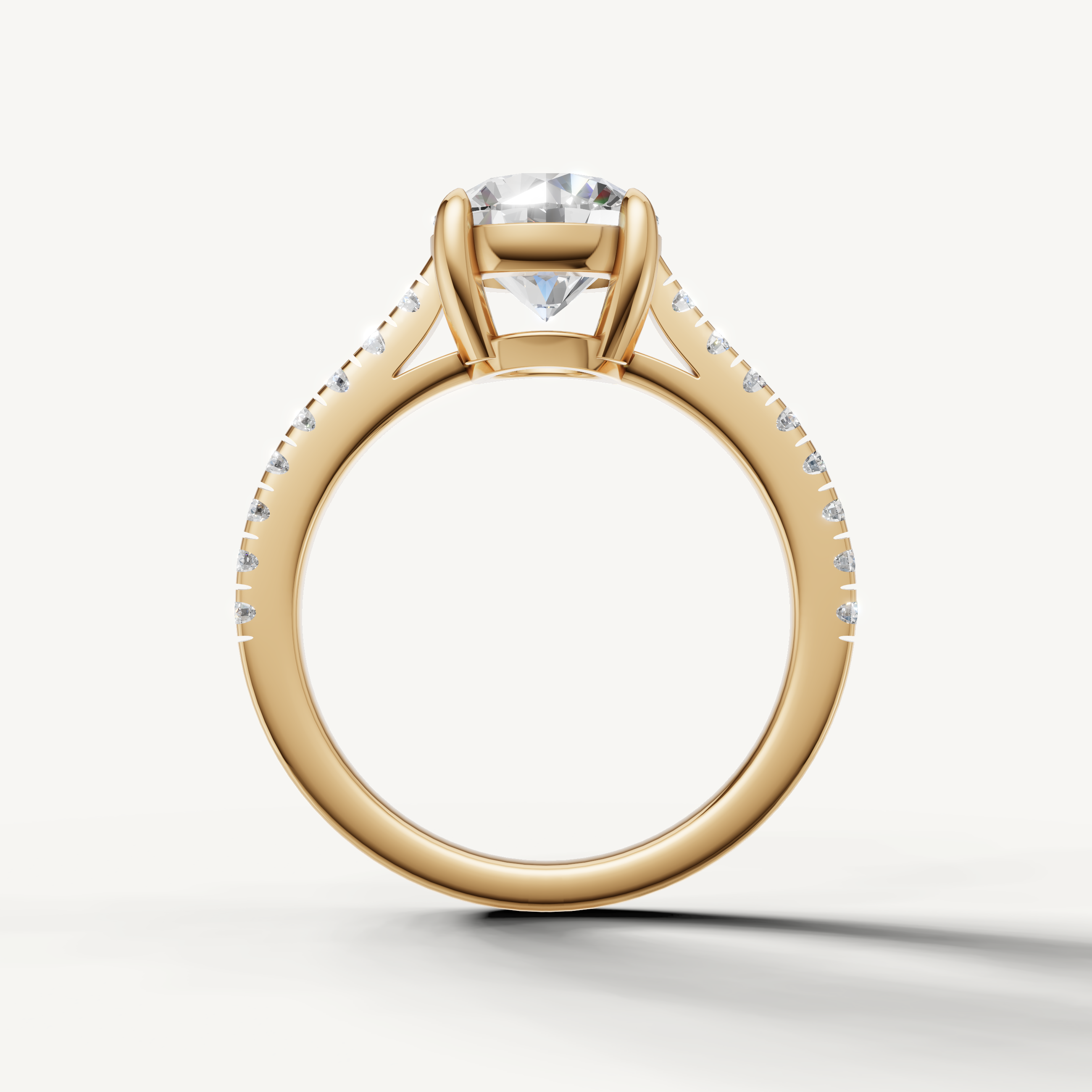Classic round brilliant lab diamond engagement ring in yellow gold with pavé band