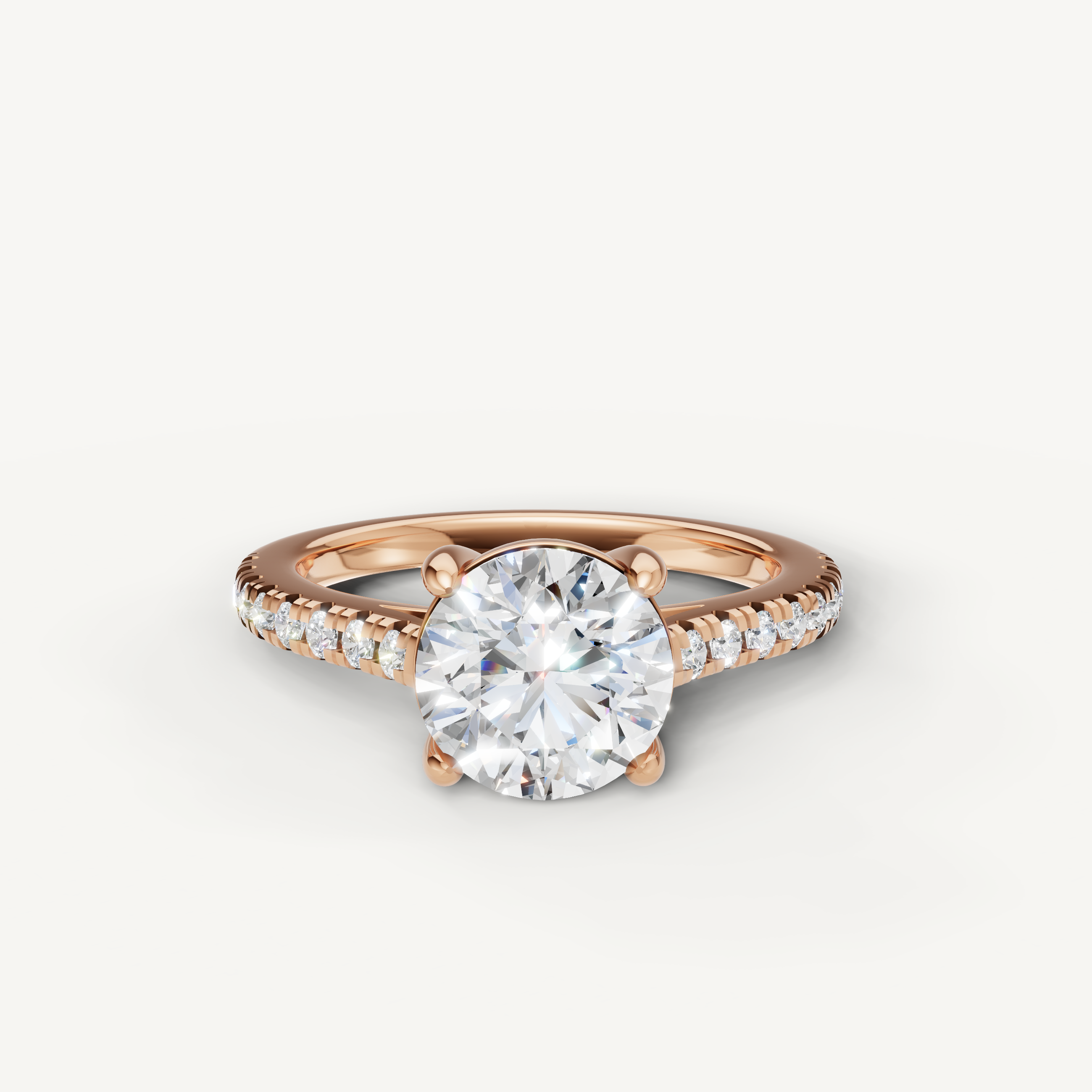 Round brilliant cut lab grown diamond engagement ring in 14K rose gold with pavé band