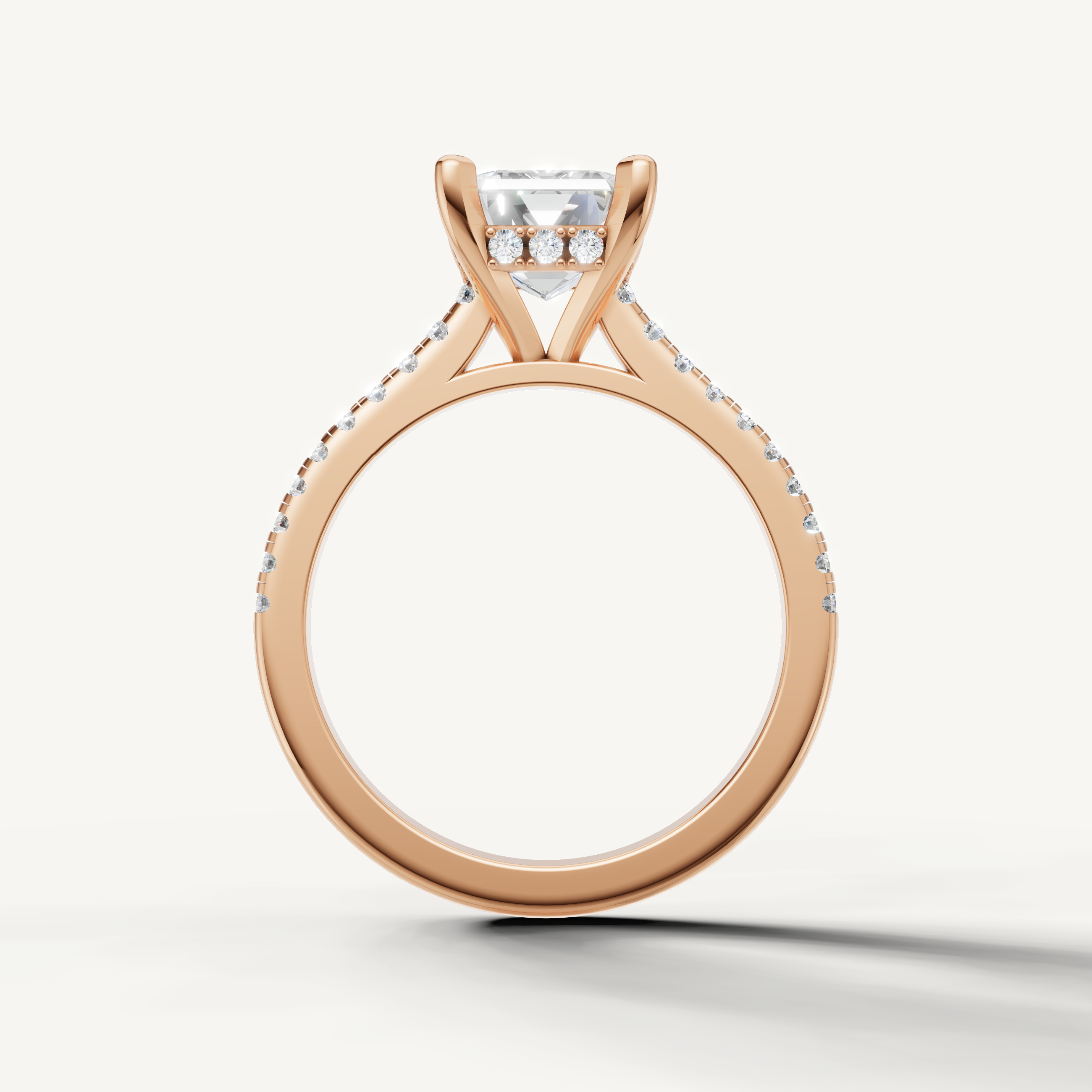Emerald diamond engagement ring with diamond accented band in 14k rose gold