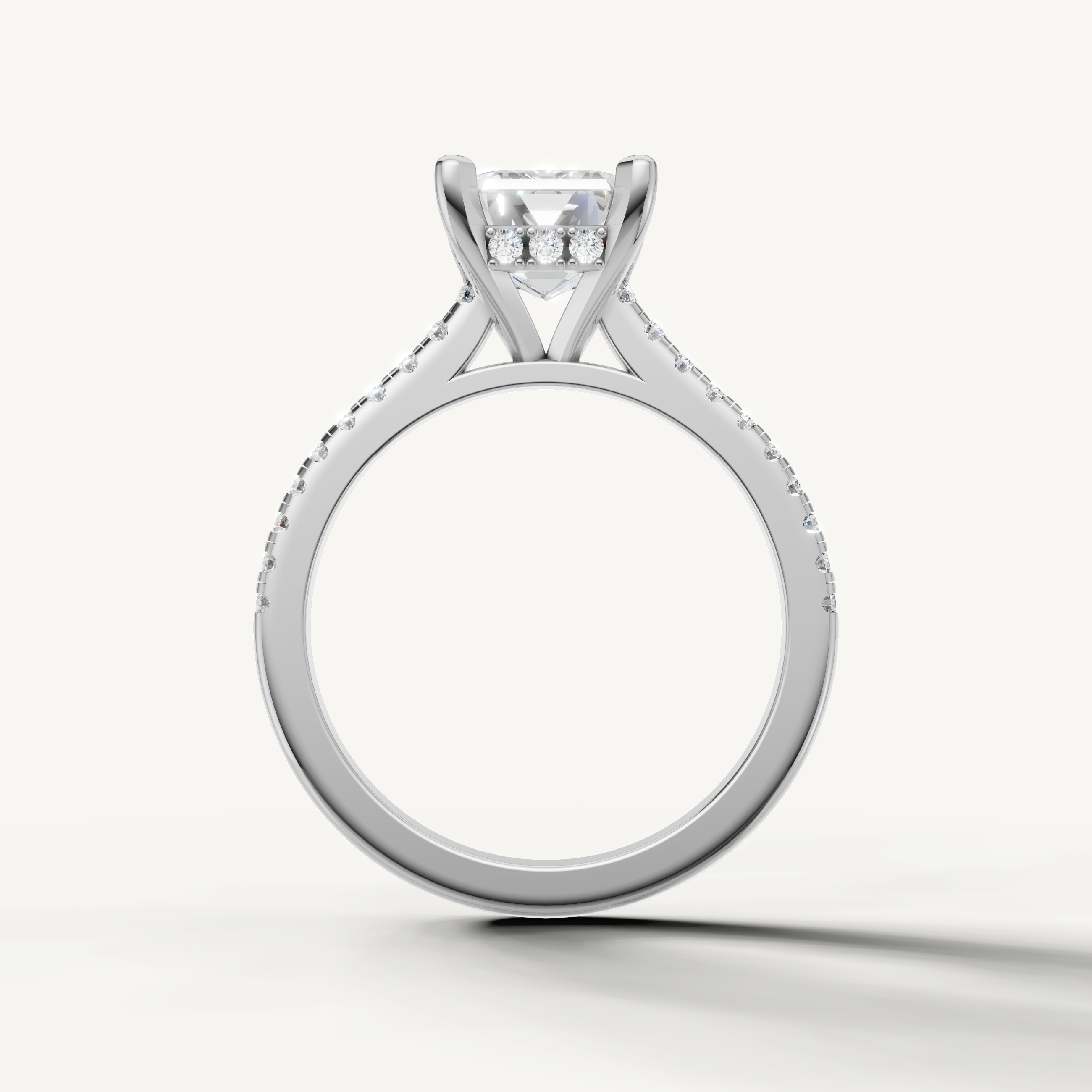 Luxury emerald step cut diamond ring with polished white gold split shank
