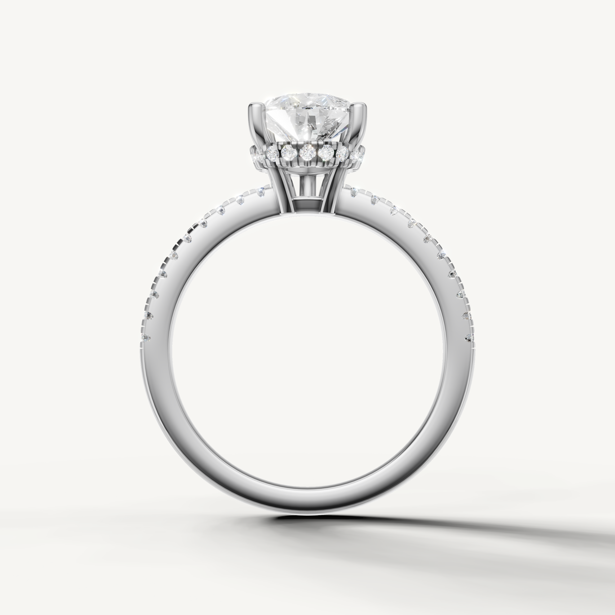 elegant pear cut engagement ring with sparkling pavé diamonds and white gold setting