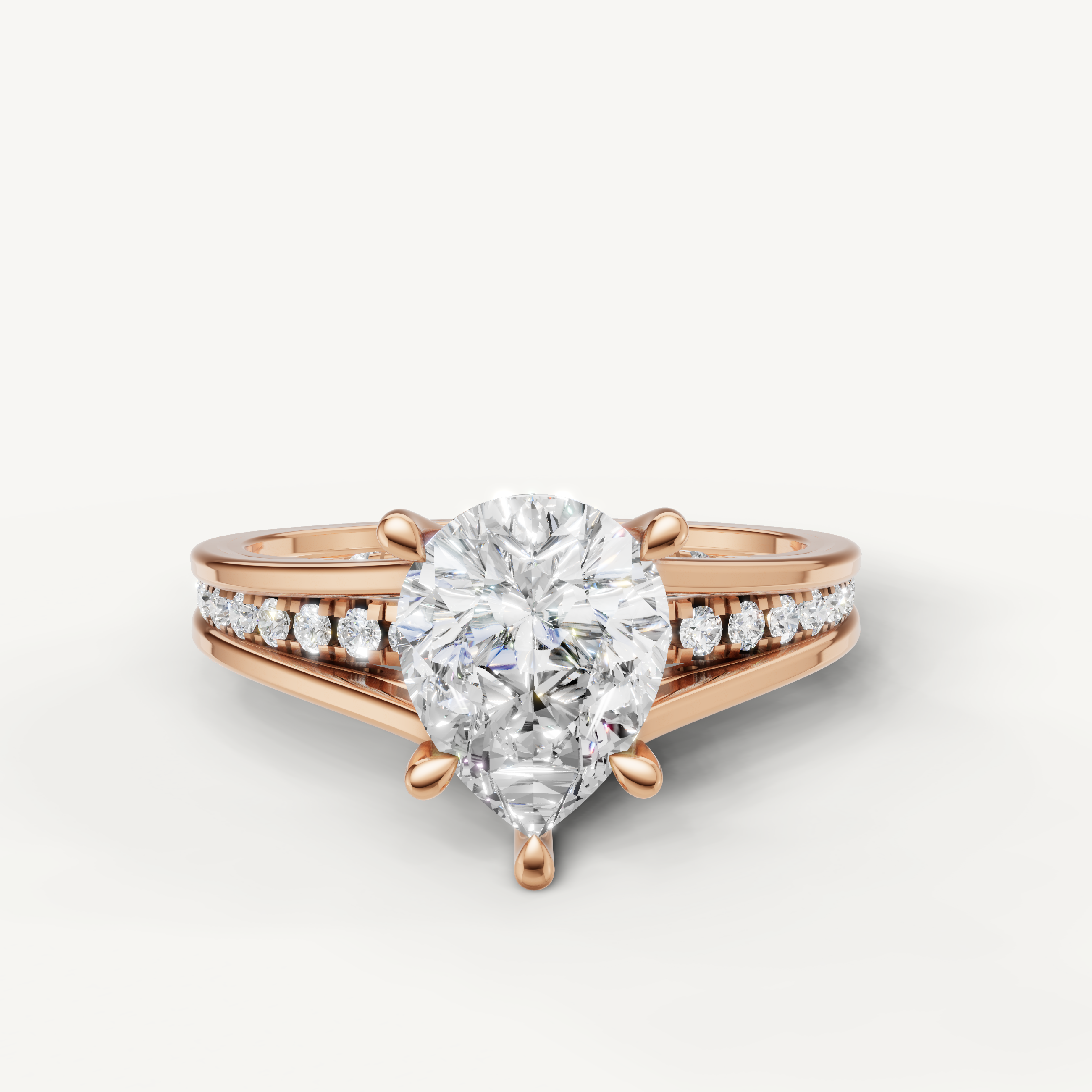Raul Diamonds rose gold pear cut engagement ring with split shank diamond band