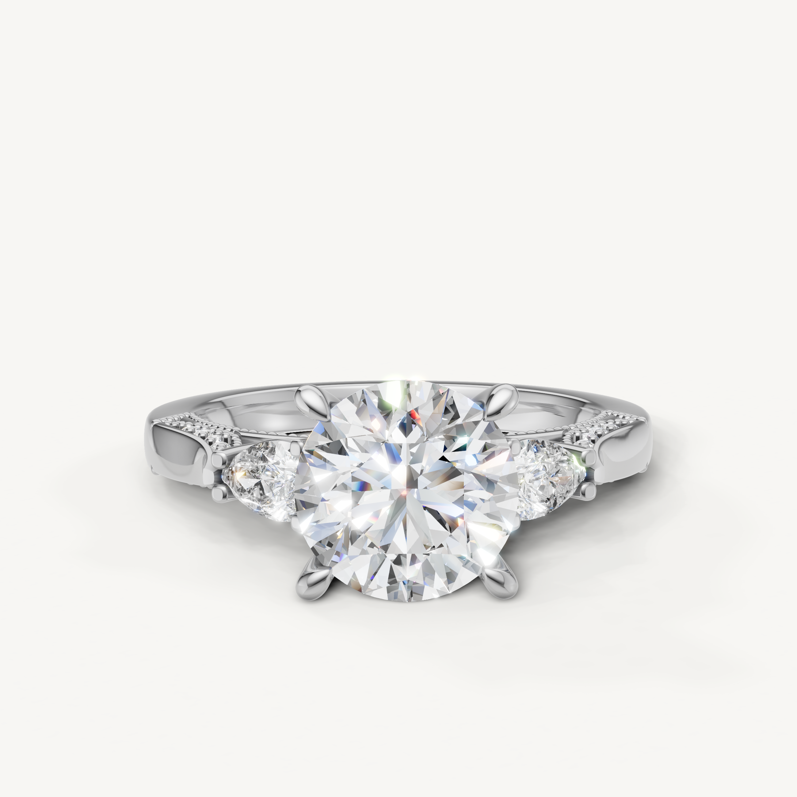 Raul Diamonds white gold round cut diamond engagement ring with pear side stones