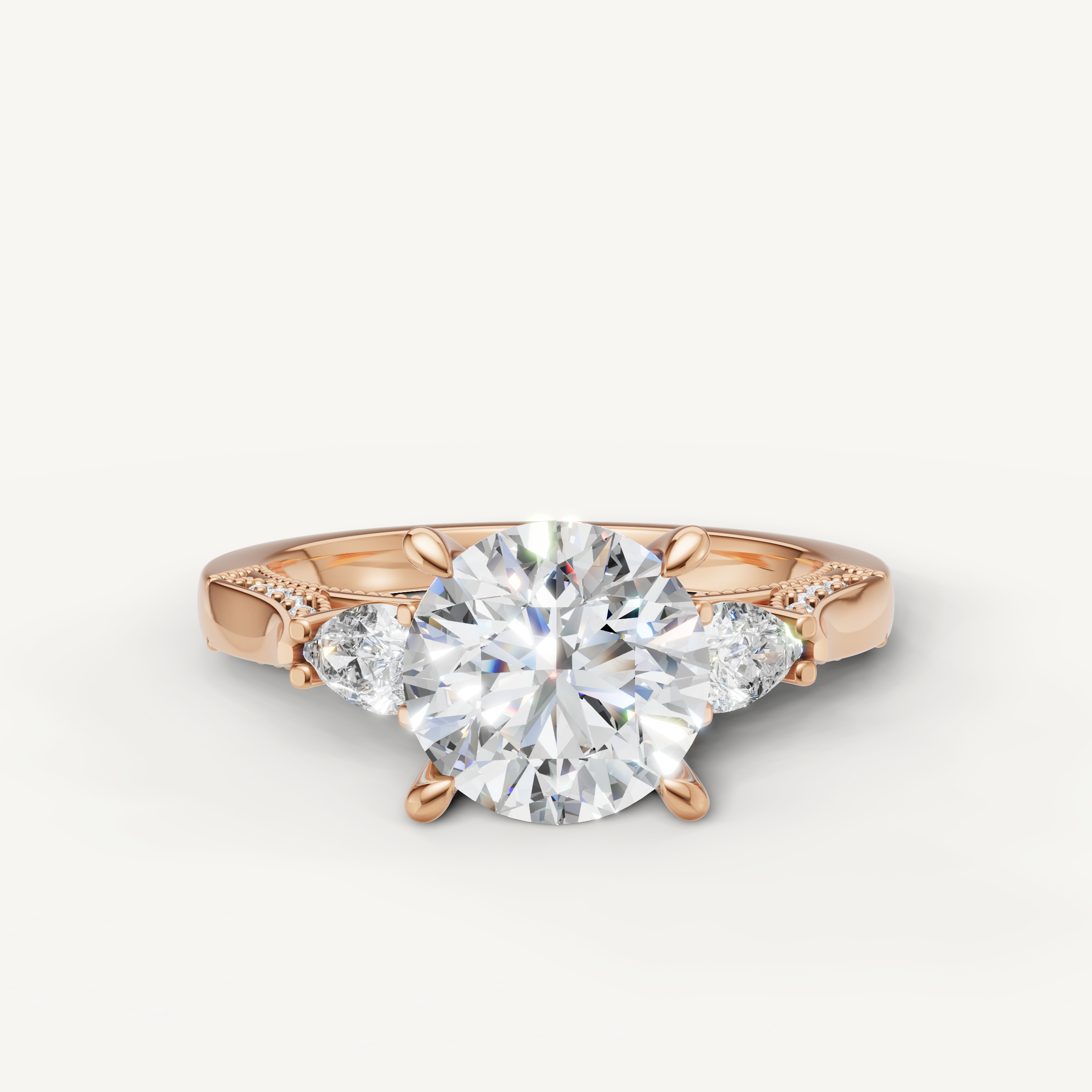 Raul Diamonds rose gold round cut diamond engagement ring with pear side stones