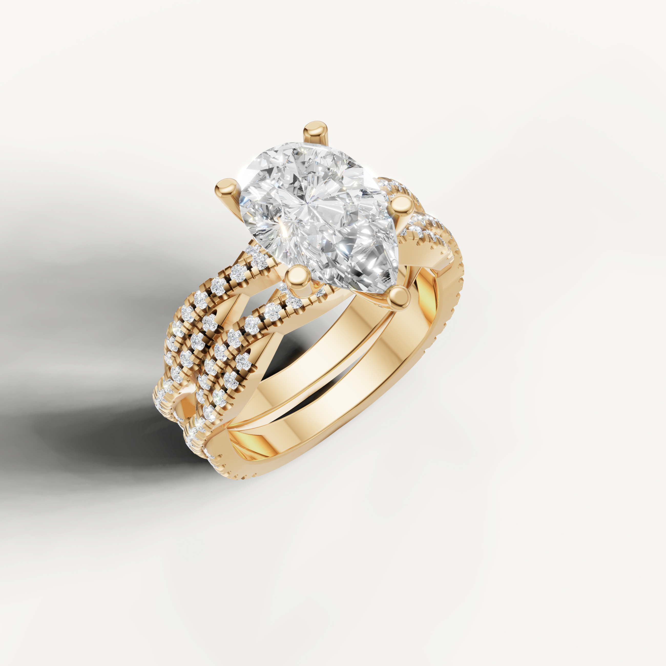 Elegant Pear Diamond Bridal Ring Set with Triple Pavé Bands Yellow Gold