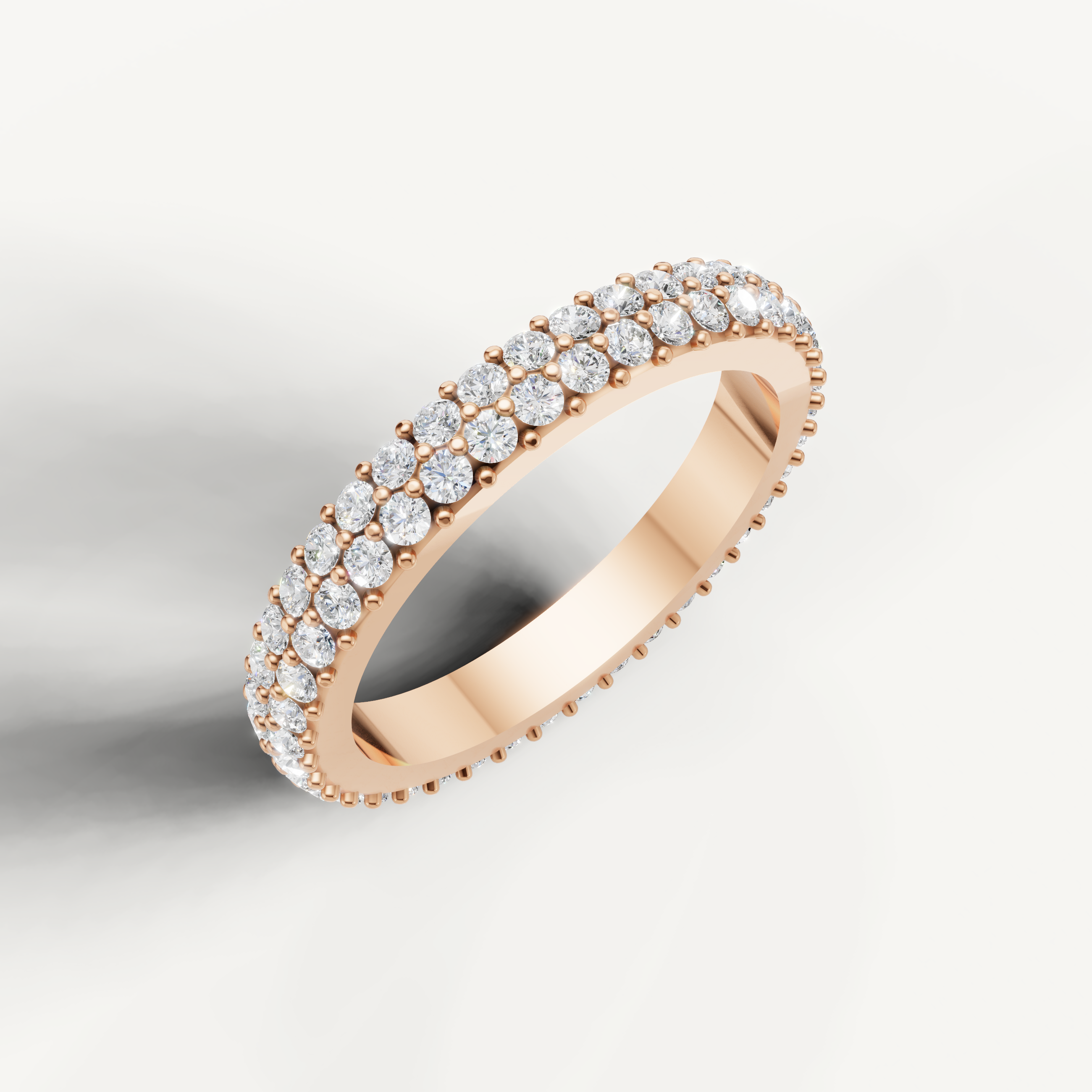 Contemporary rose gold diamond wedding band with brilliant round pavé setting