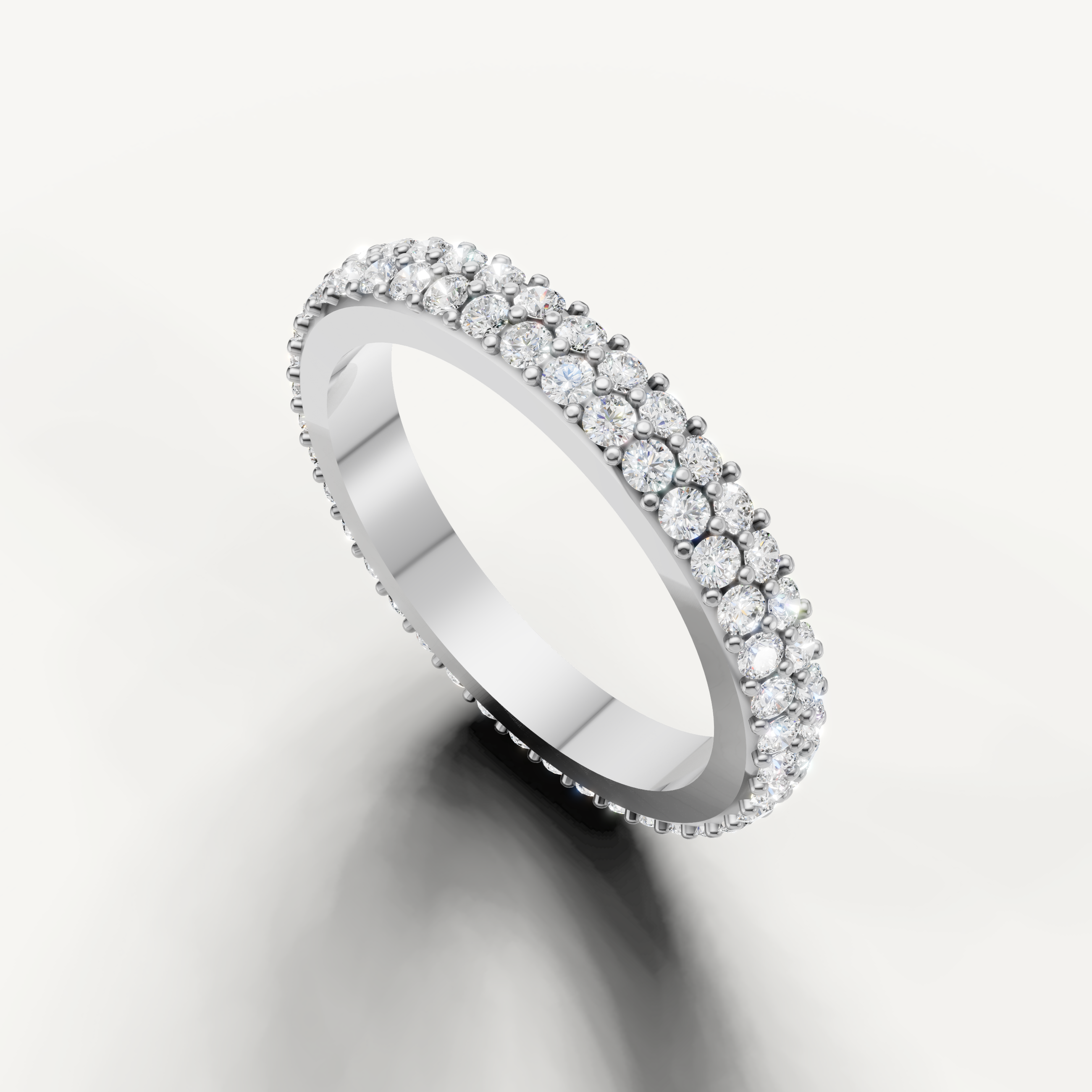 Modern white gold eternity wedding band by Raul Diamonds with pavé diamond detailing