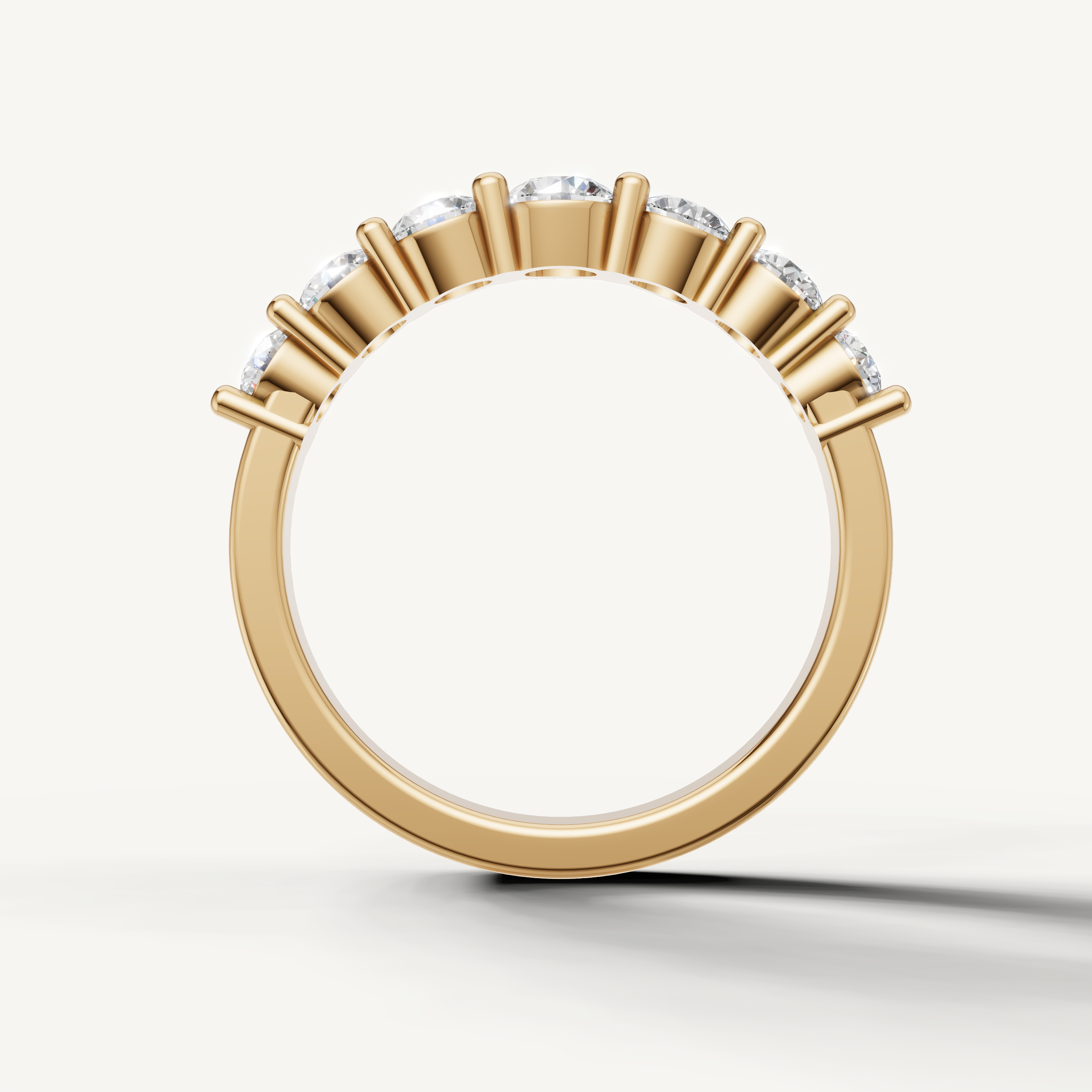 Modern yellow gold wedding band with classic shared prong round diamond design for women