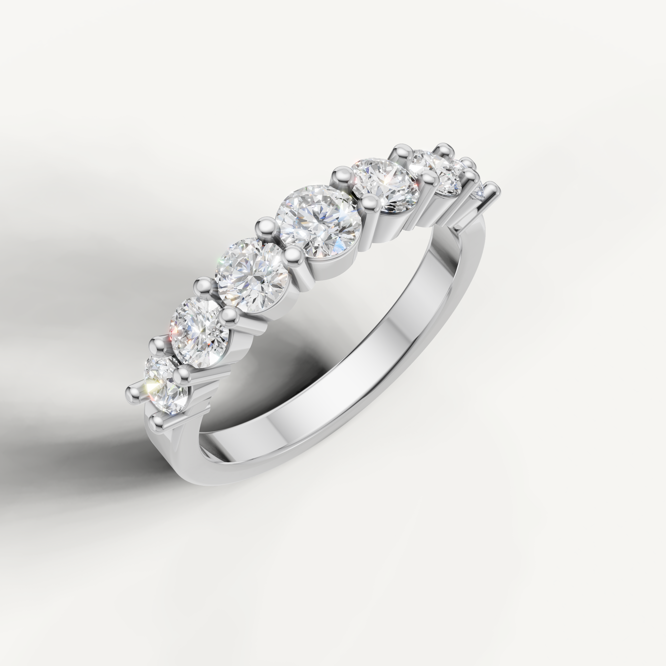 Elegant white gold diamond wedding band with graduated round cut diamonds