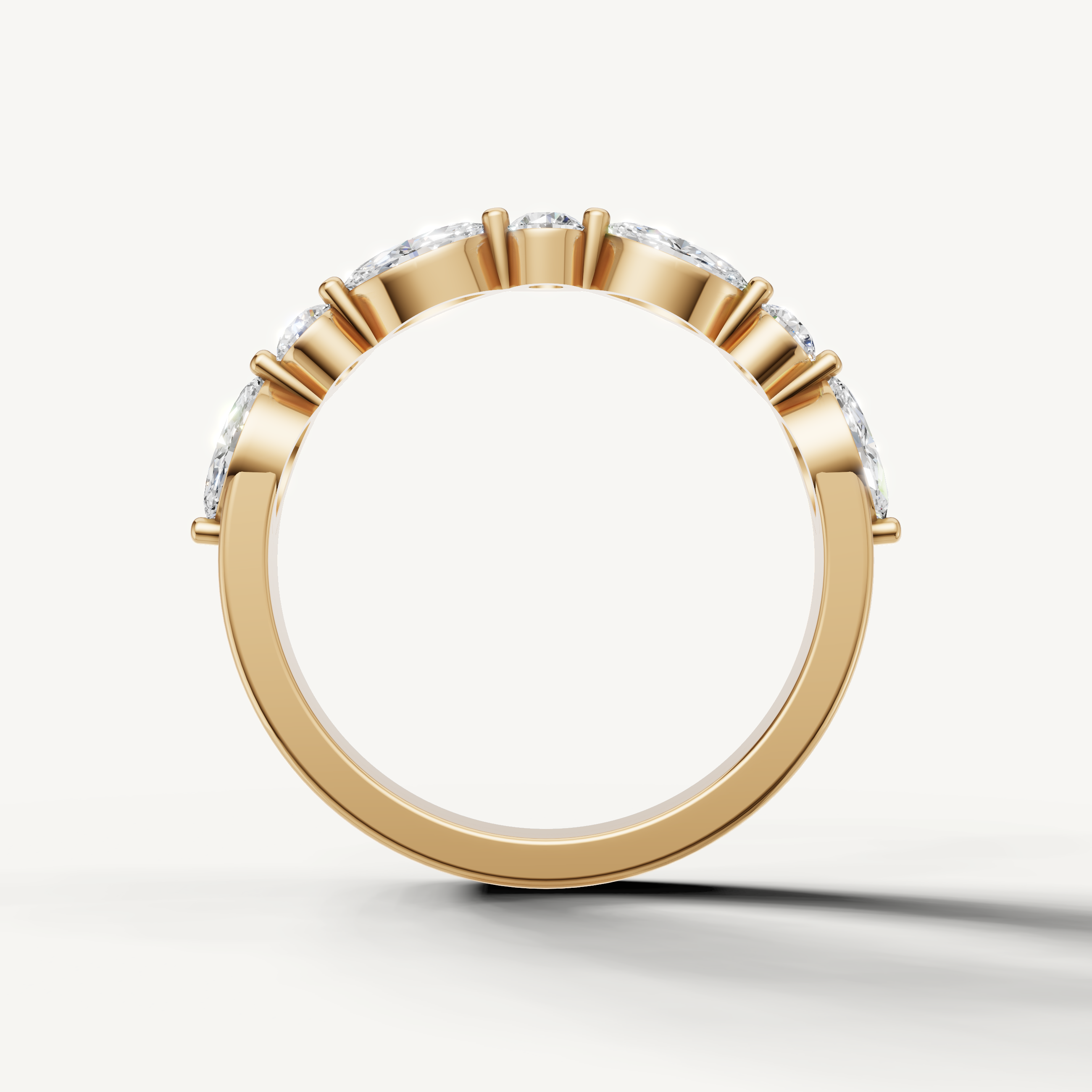 Raul Diamonds fine yellow gold wedding ring with pear cut side stones and round center diamond accents