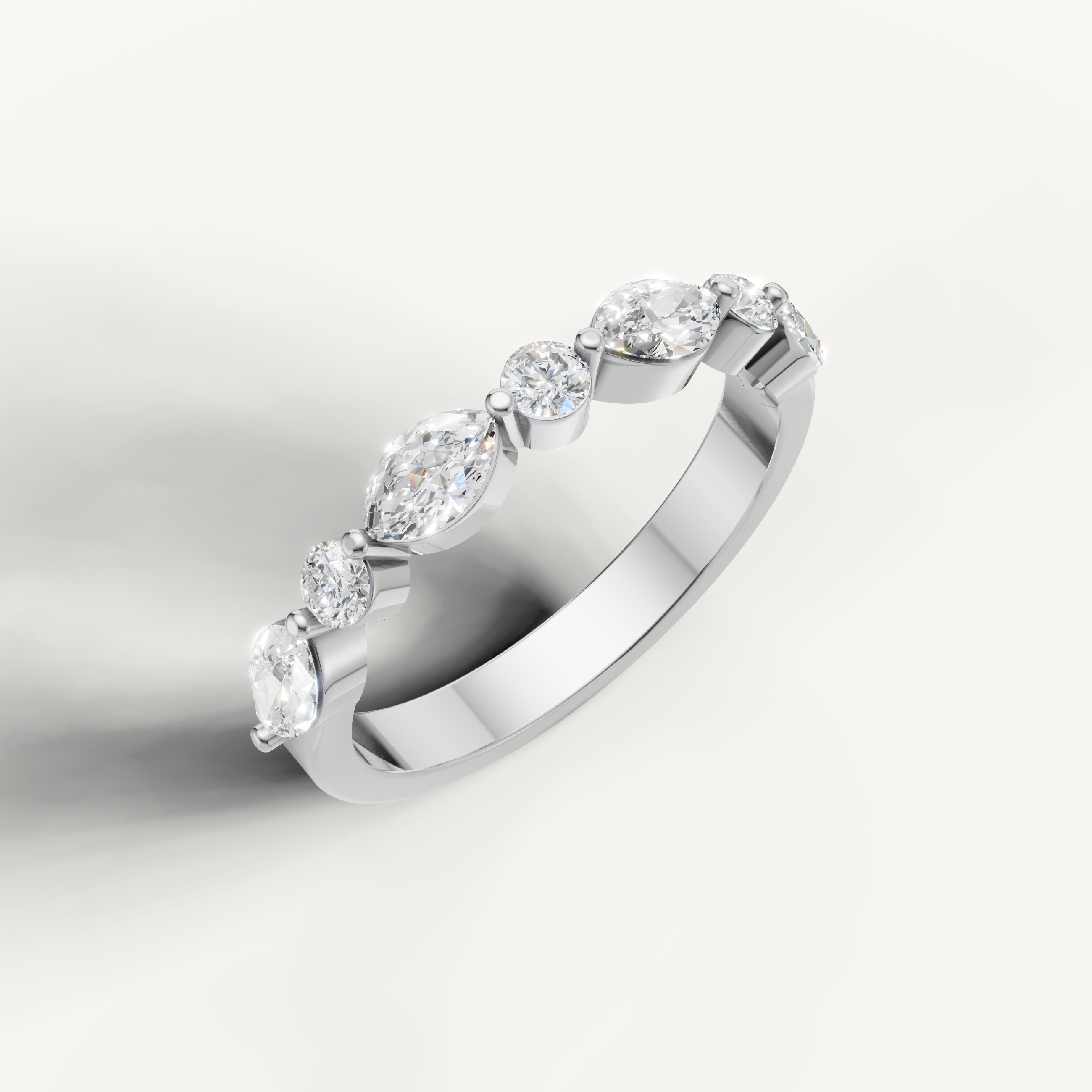 Elegant white gold diamond wedding ring featuring alternating pear and round lab grown diamonds