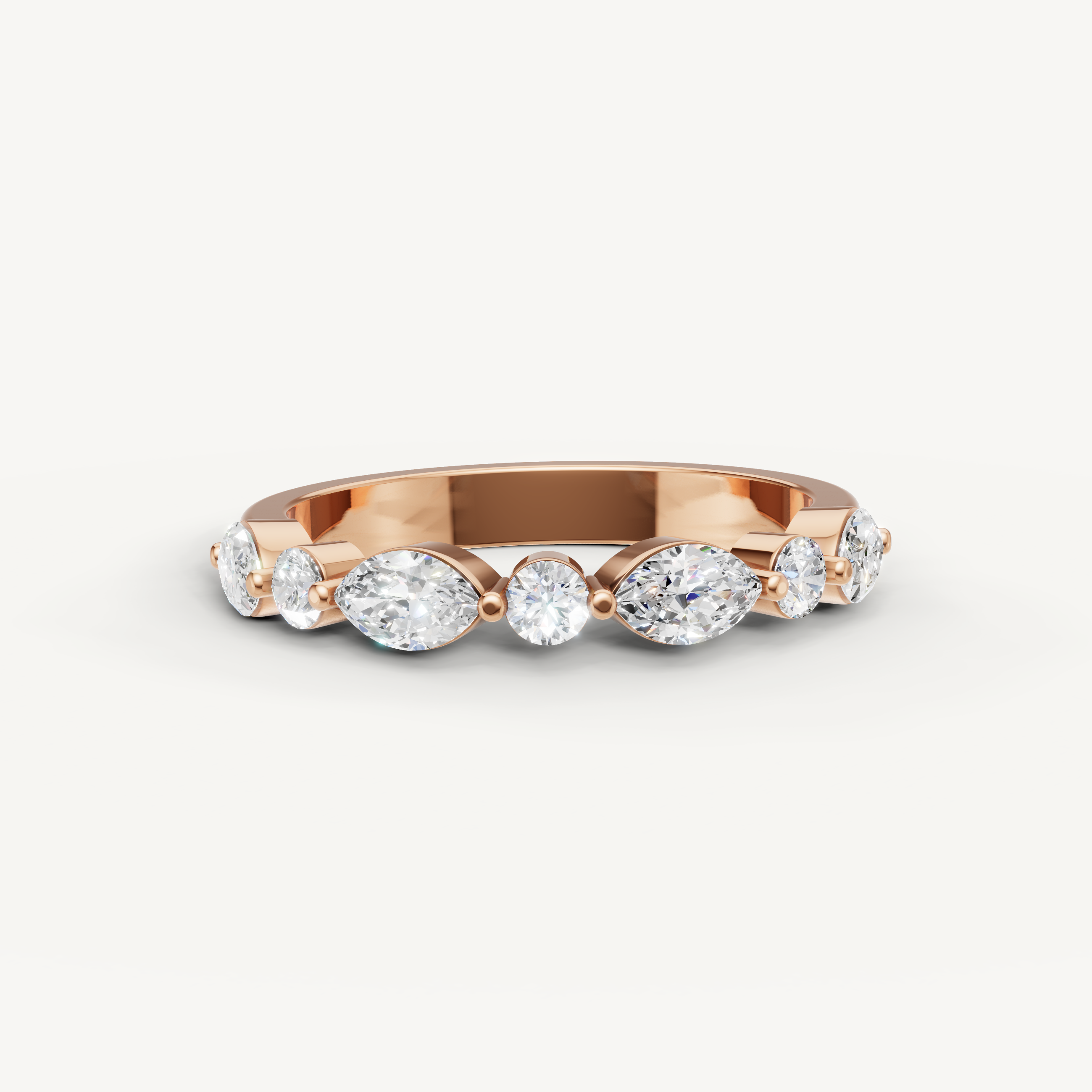 Raul Diamonds rose gold wedding band with pear and round cut lab grown diamonds in a contemporary design