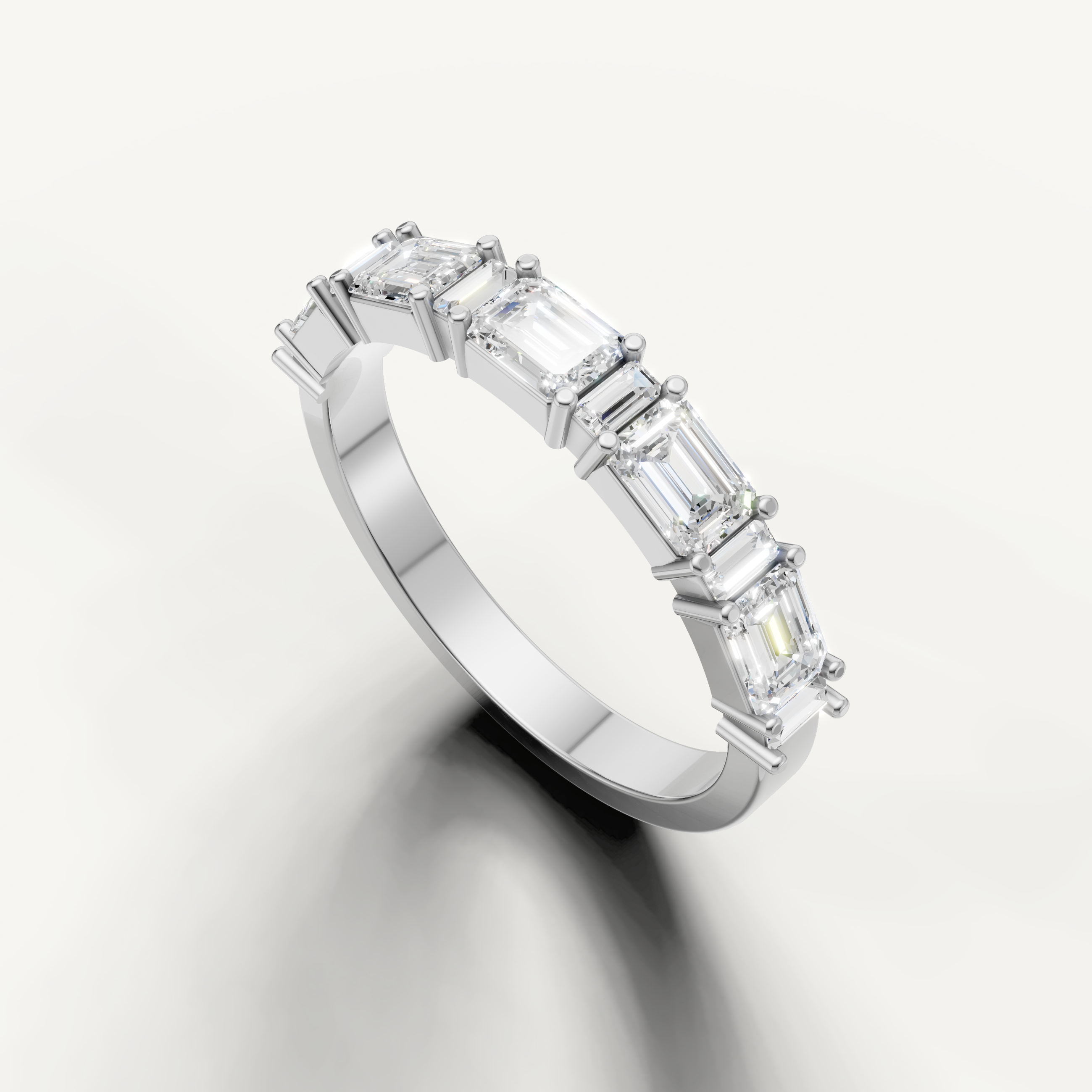 Luxury white gold anniversary band featuring emerald cut diamonds crafted by Raul Diamonds