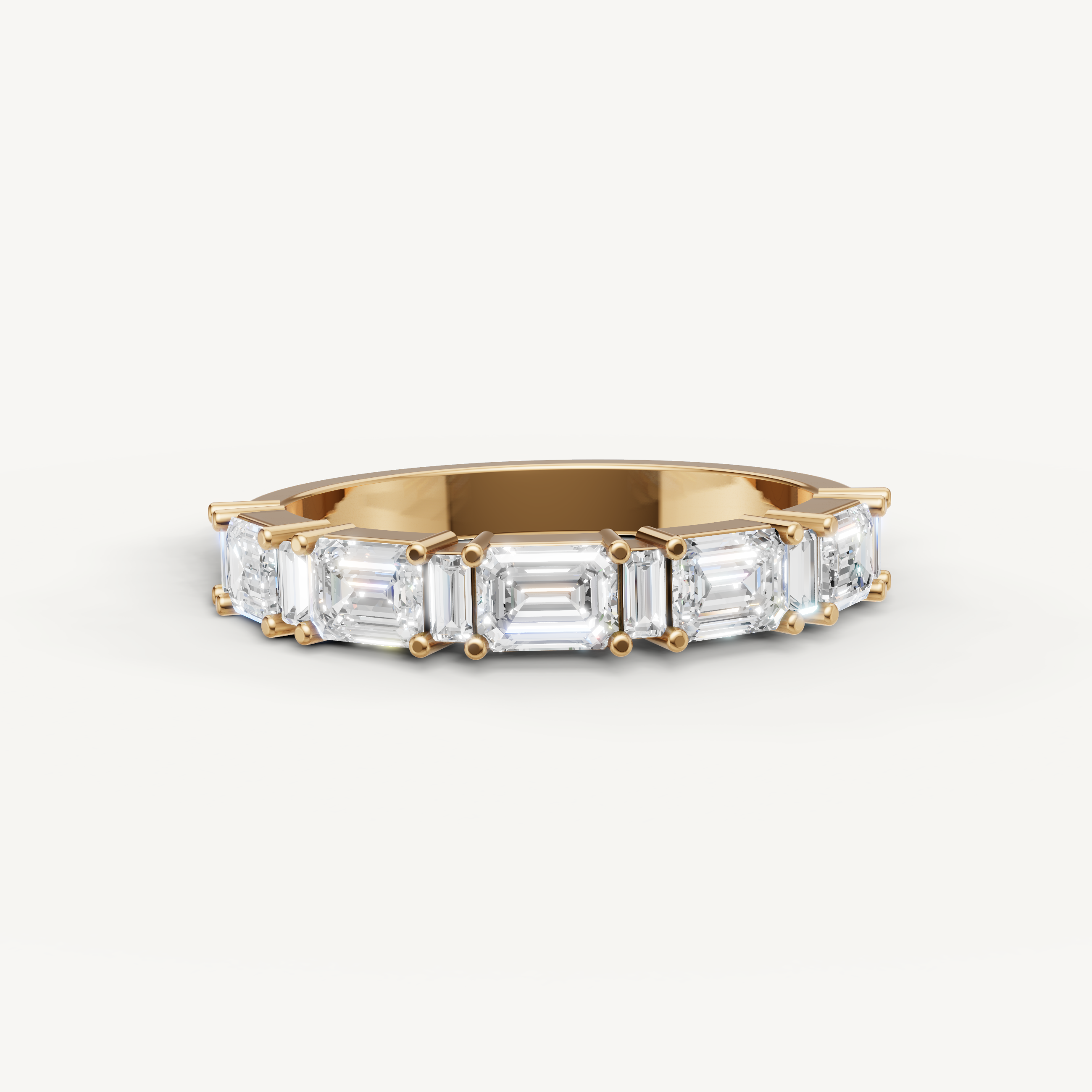 Raul Diamonds yellow gold wedding band with emerald cut lab grown diamonds in an elegant eternity style