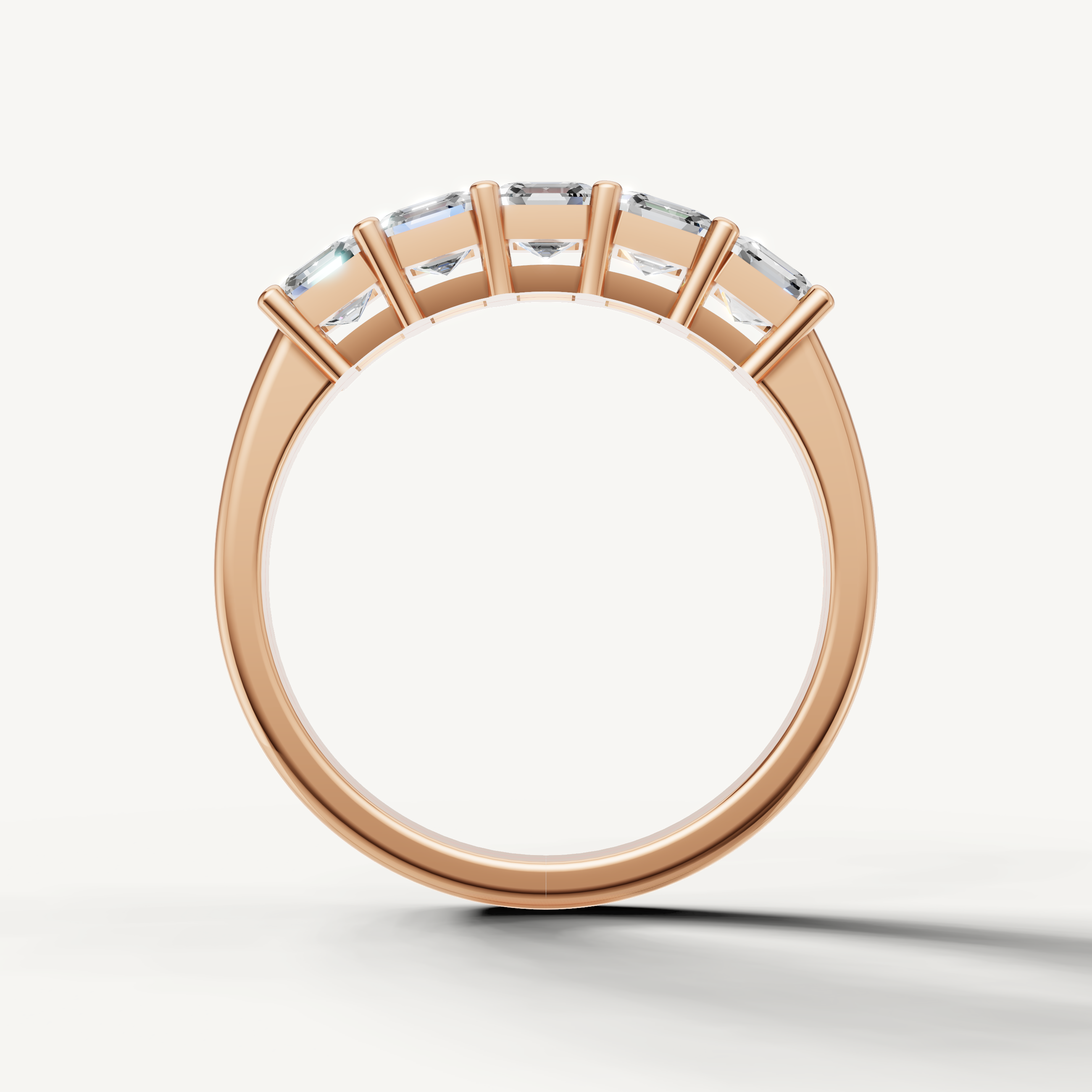 Elegant rose gold wedding ring featuring Asscher cut diamonds in a refined modern setting