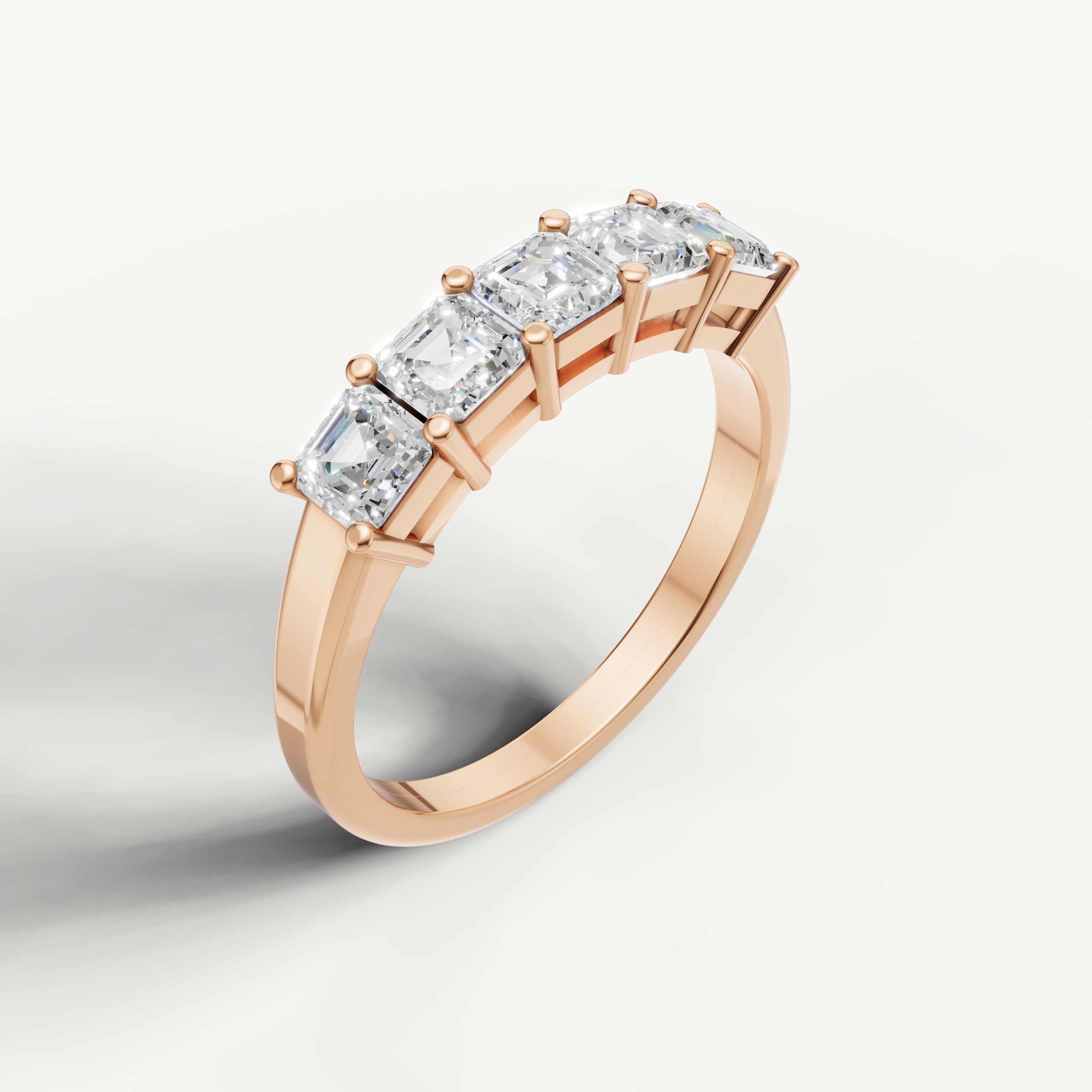Fine rose gold diamond wedding band crafted with step cut Asscher diamonds by Raul Diamonds