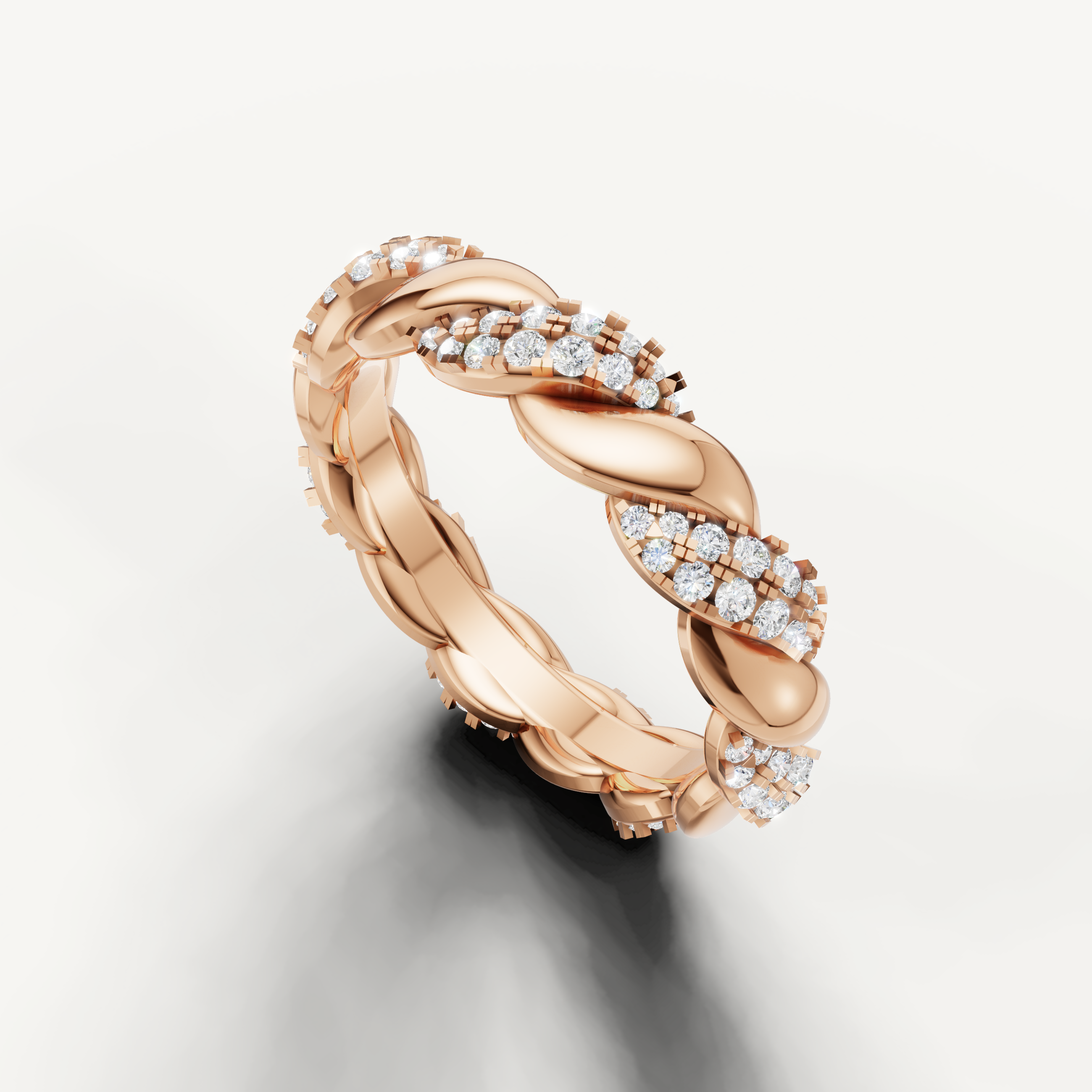 Rose gold eternity wedding band with sparkling pavé diamonds and intricate braided craftsmanship from Raul Diamonds