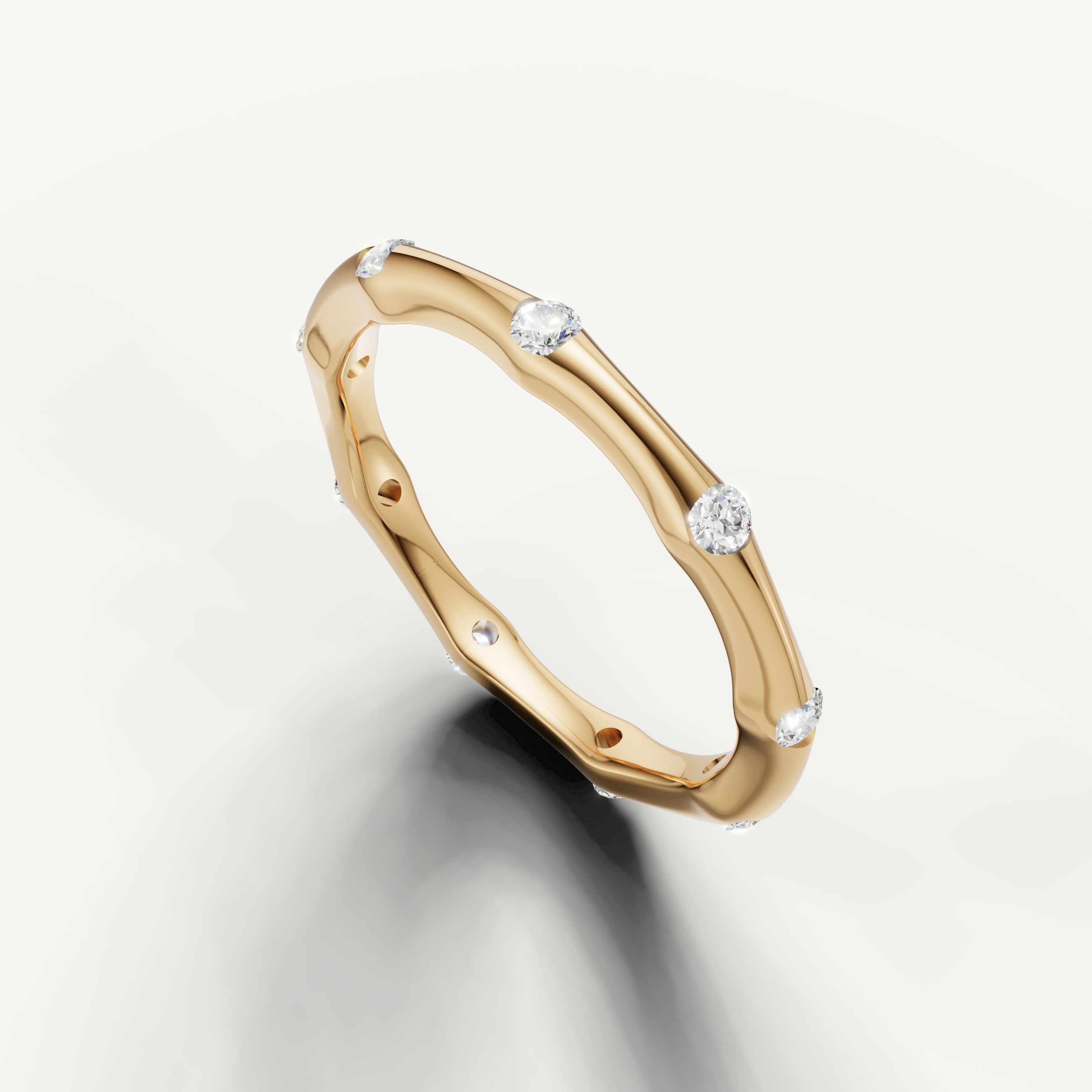 Luxury yellow gold diamond wedding band with spaced round diamonds and contemporary wave design from Raul Diamonds