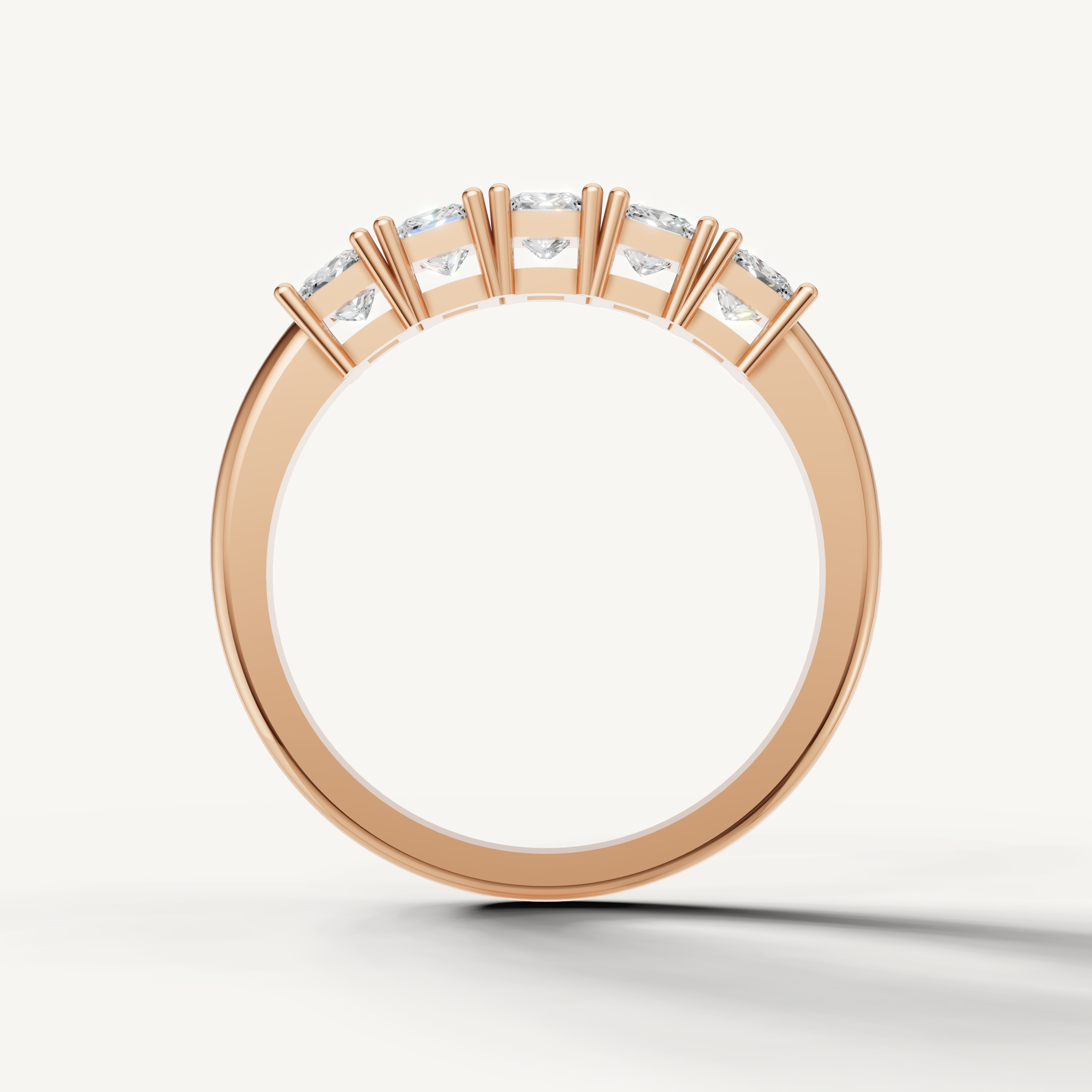 Luxury rose gold wedding band with shared prong princess diamonds by Raul Diamonds