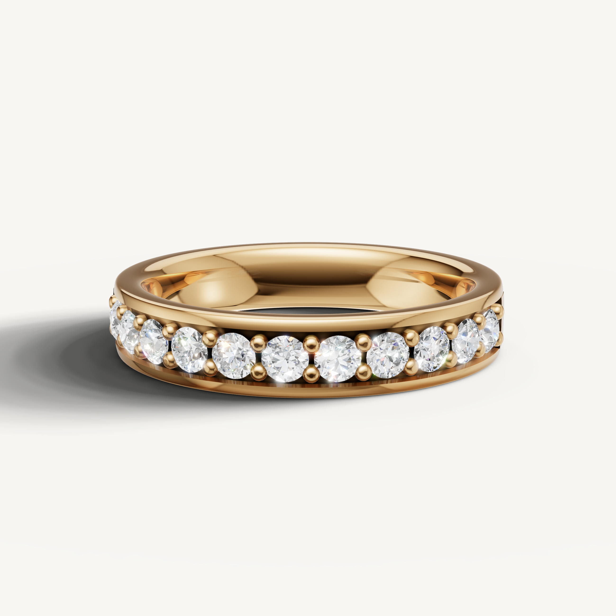 Raul Diamonds yellow gold diamond wedding band with round brilliant channel set diamonds