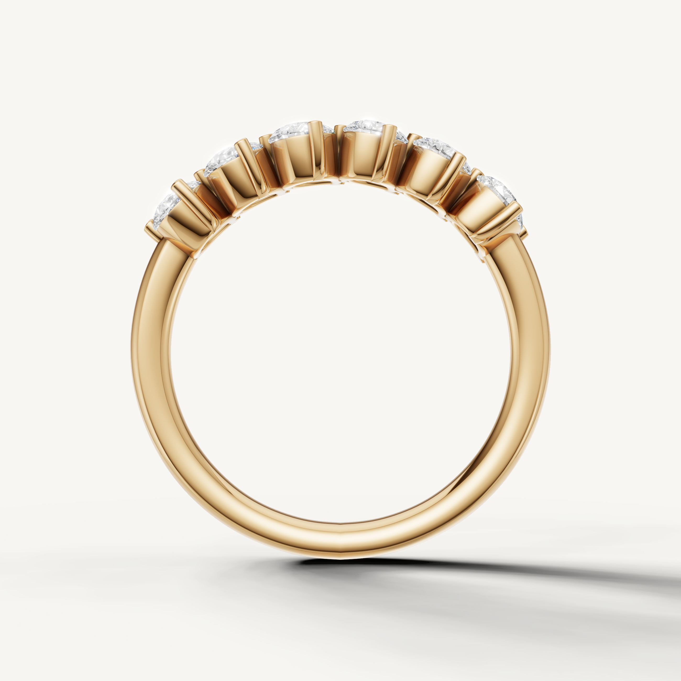 Modern yellow gold pear diamond eternity wedding band with brilliant sparkle