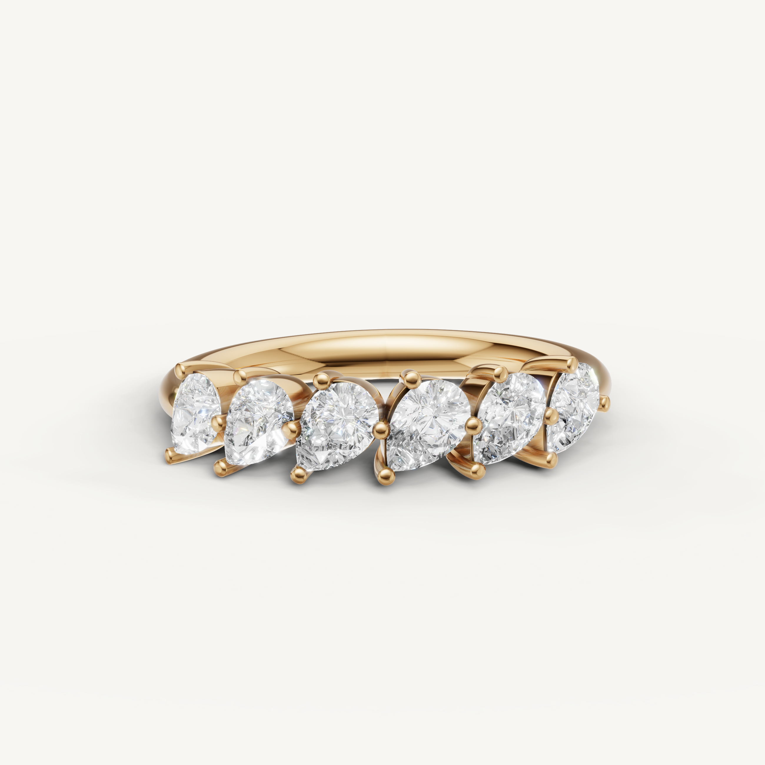 Raul Diamonds yellow gold pear cut diamond wedding band with elegant shared prong setting