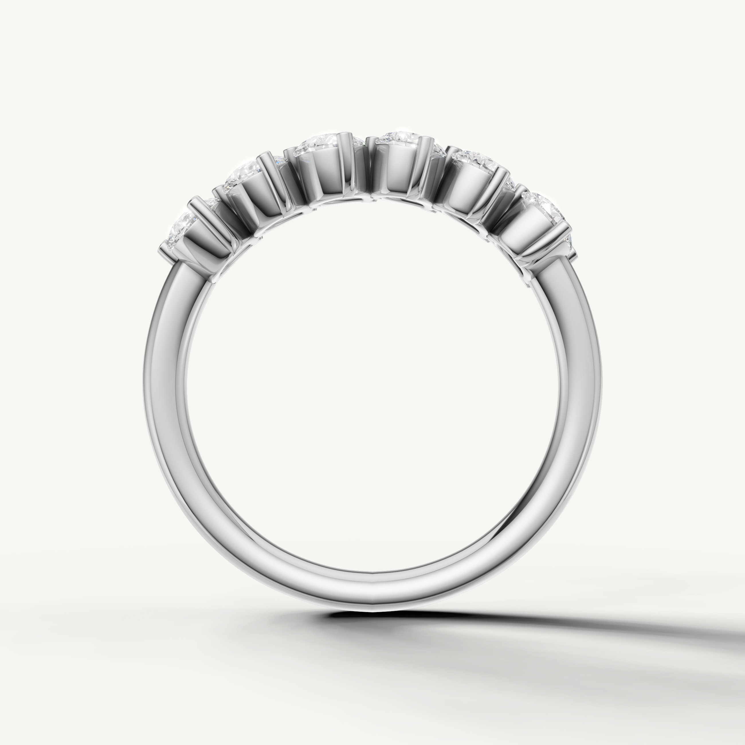 Modern white gold diamond anniversary band with pear shaped diamonds