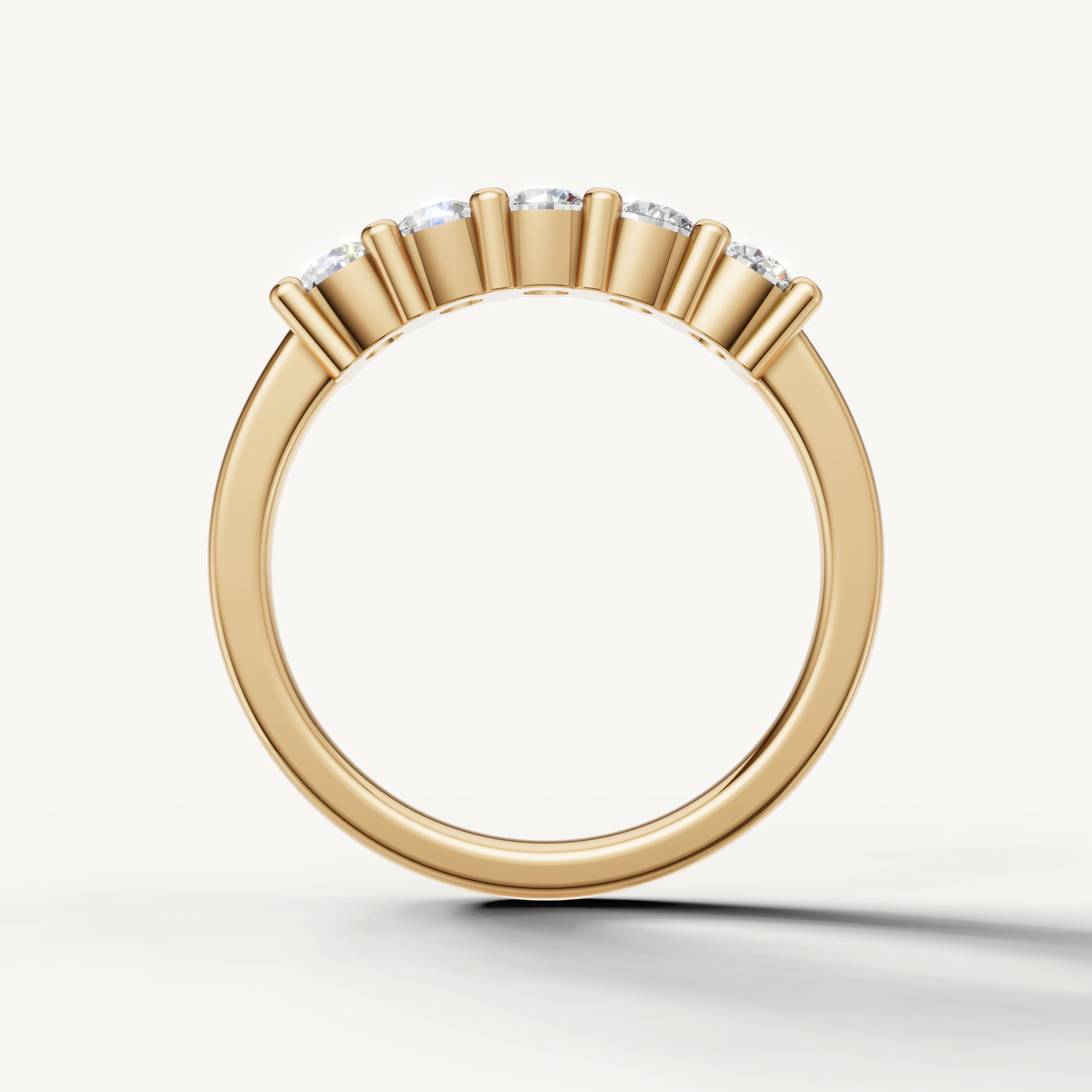 Classic yellow gold shared prong diamond wedding band for women by Raul Diamonds