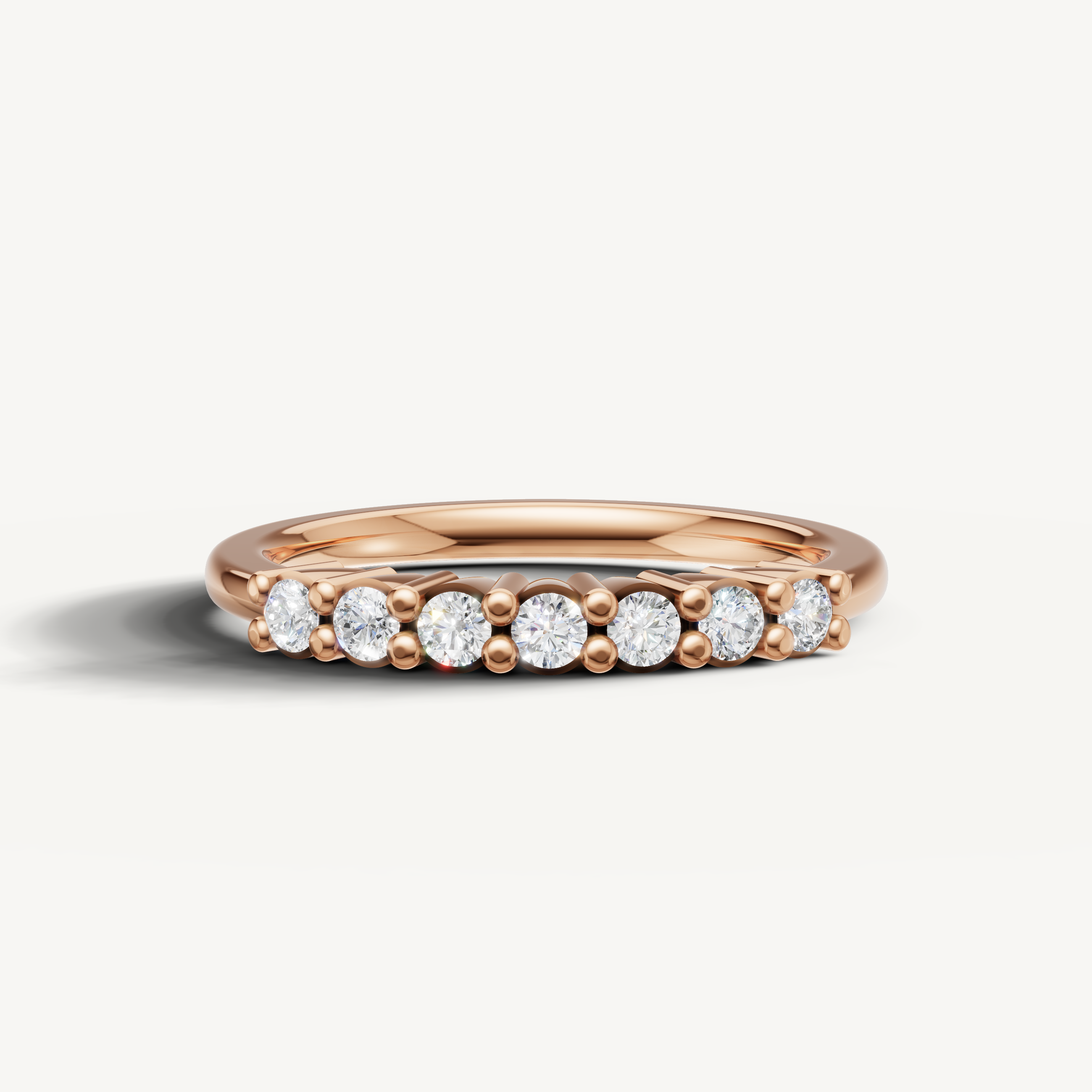 Raul Diamonds rose gold round diamond wedding band with shared prong setting