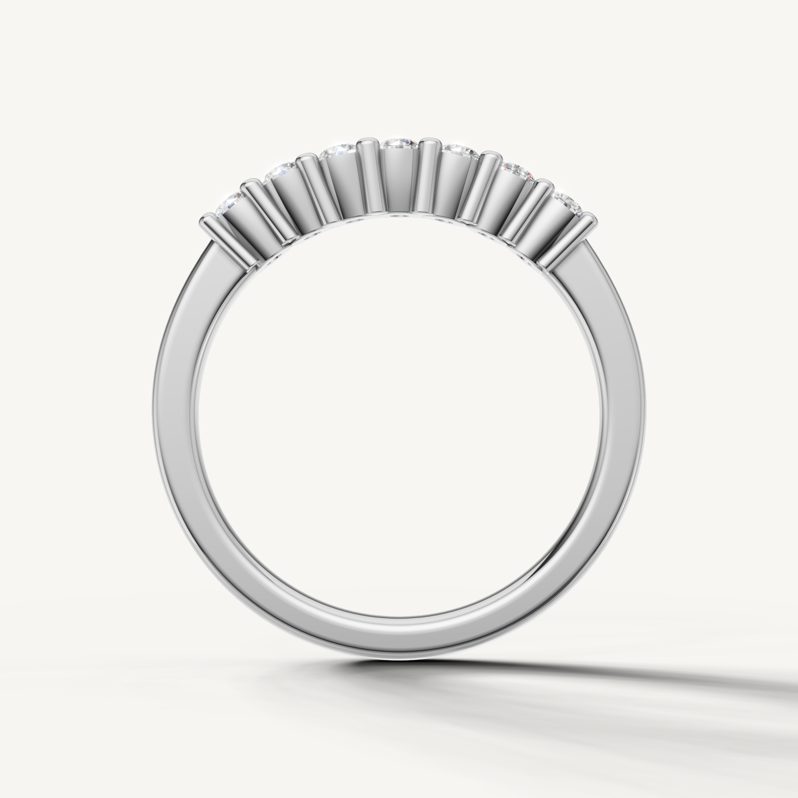 Modern white gold shared prong diamond wedding band with timeless design