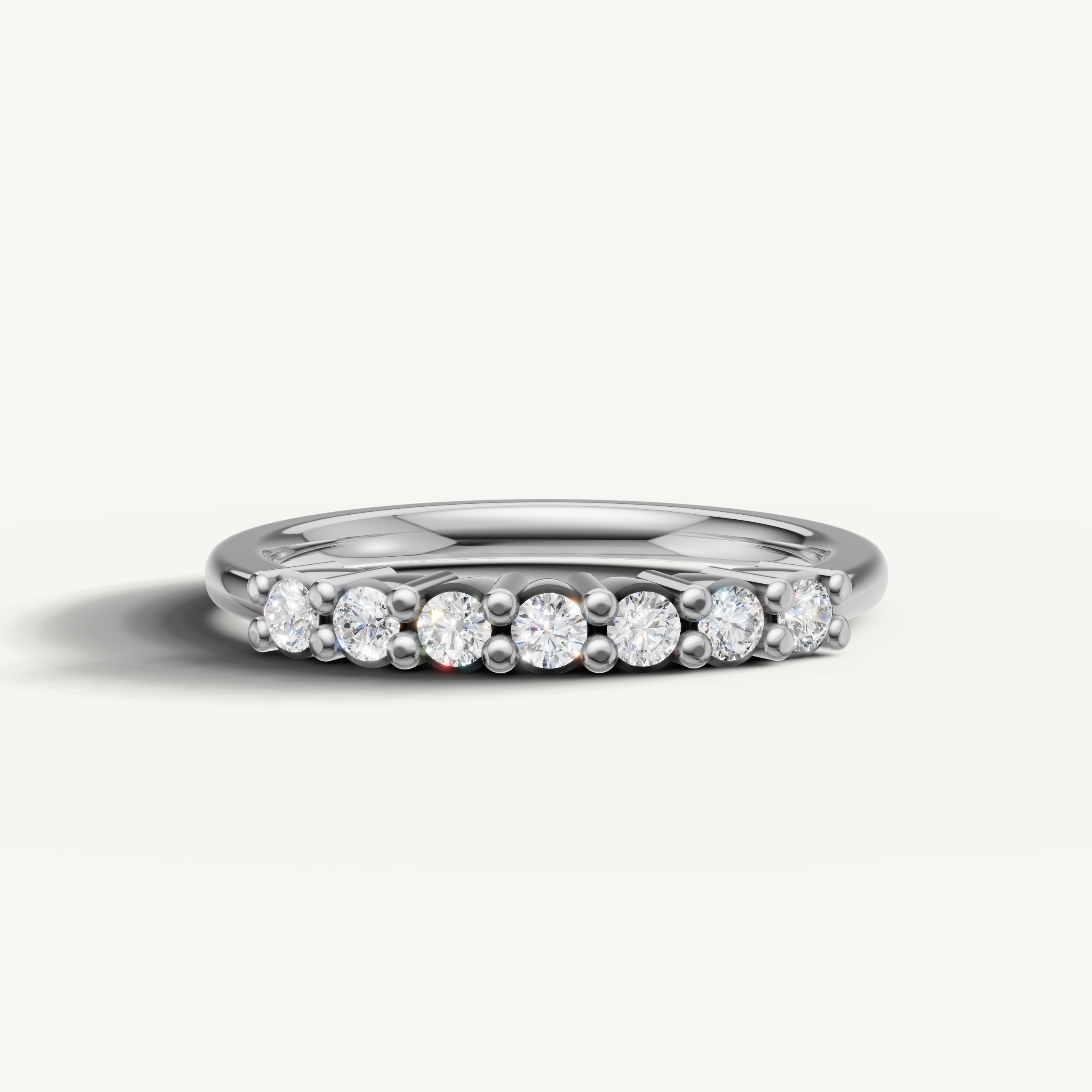 Raul Diamonds white gold round diamond wedding band with shared prong diamonds