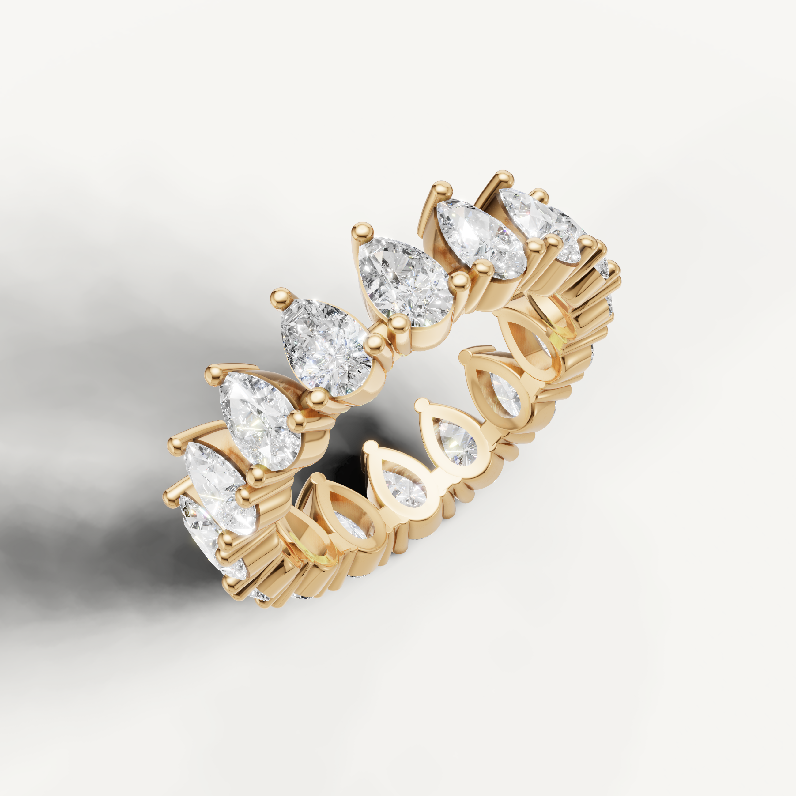 Elegant yellow gold pear cut diamond wedding band for women by Raul Diamonds