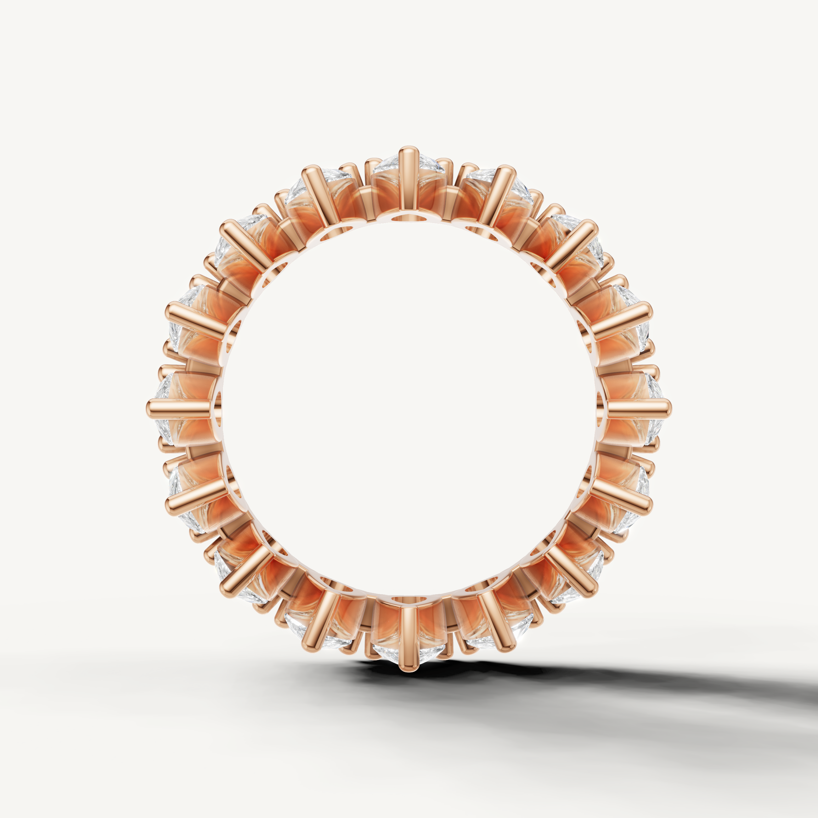Elegant rose gold eternity wedding band with pear shaped diamonds by Raul Diamonds