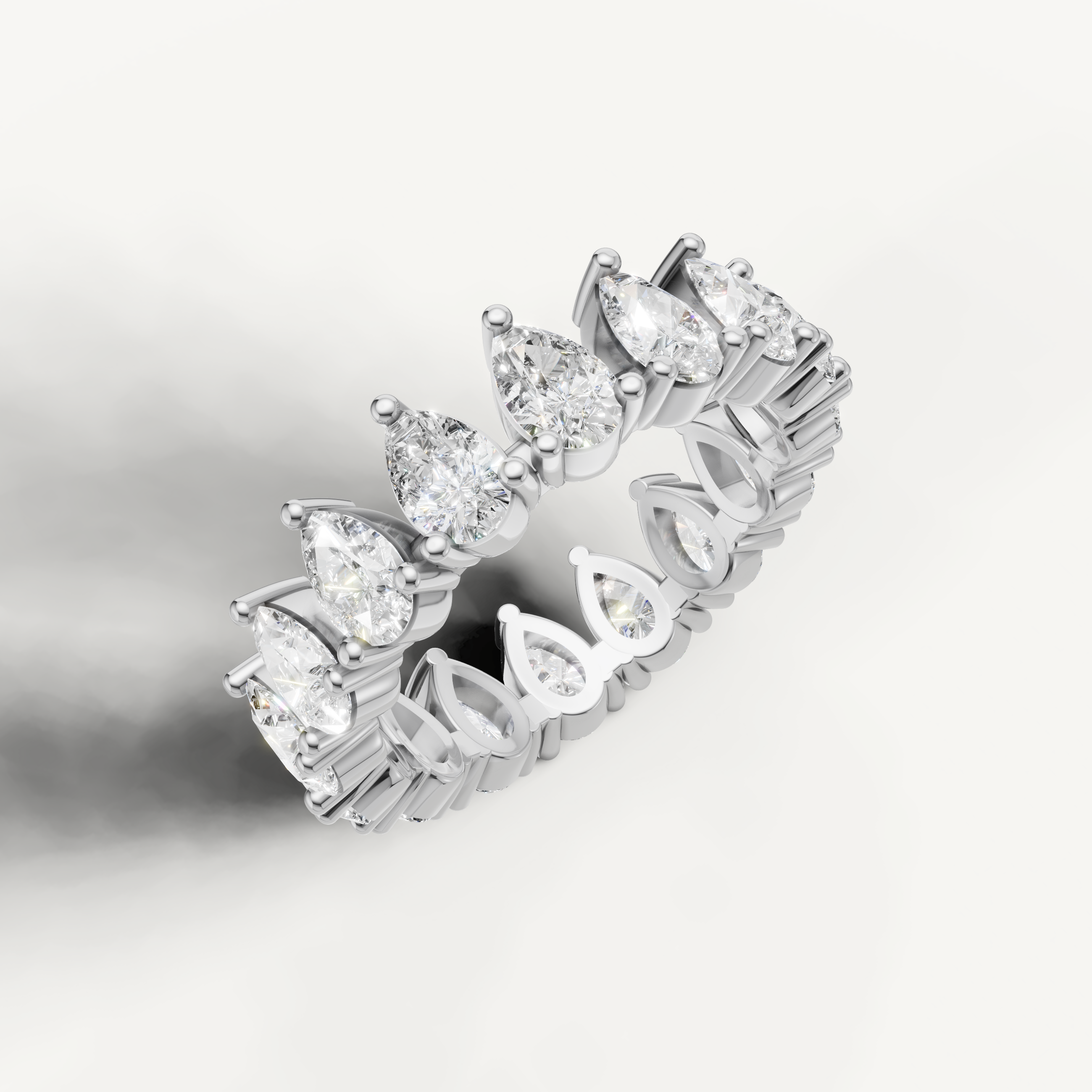 Elegant white gold pear cut diamond wedding ring with luxury sparkle by Raul Diamonds