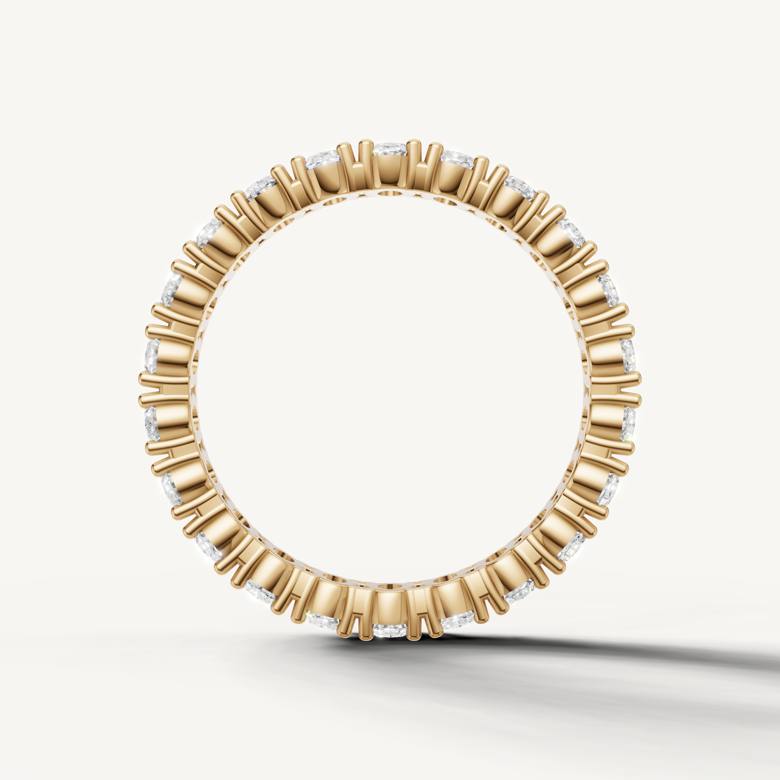 Classic yellow gold oval diamond eternity band crafted by Raul Diamonds