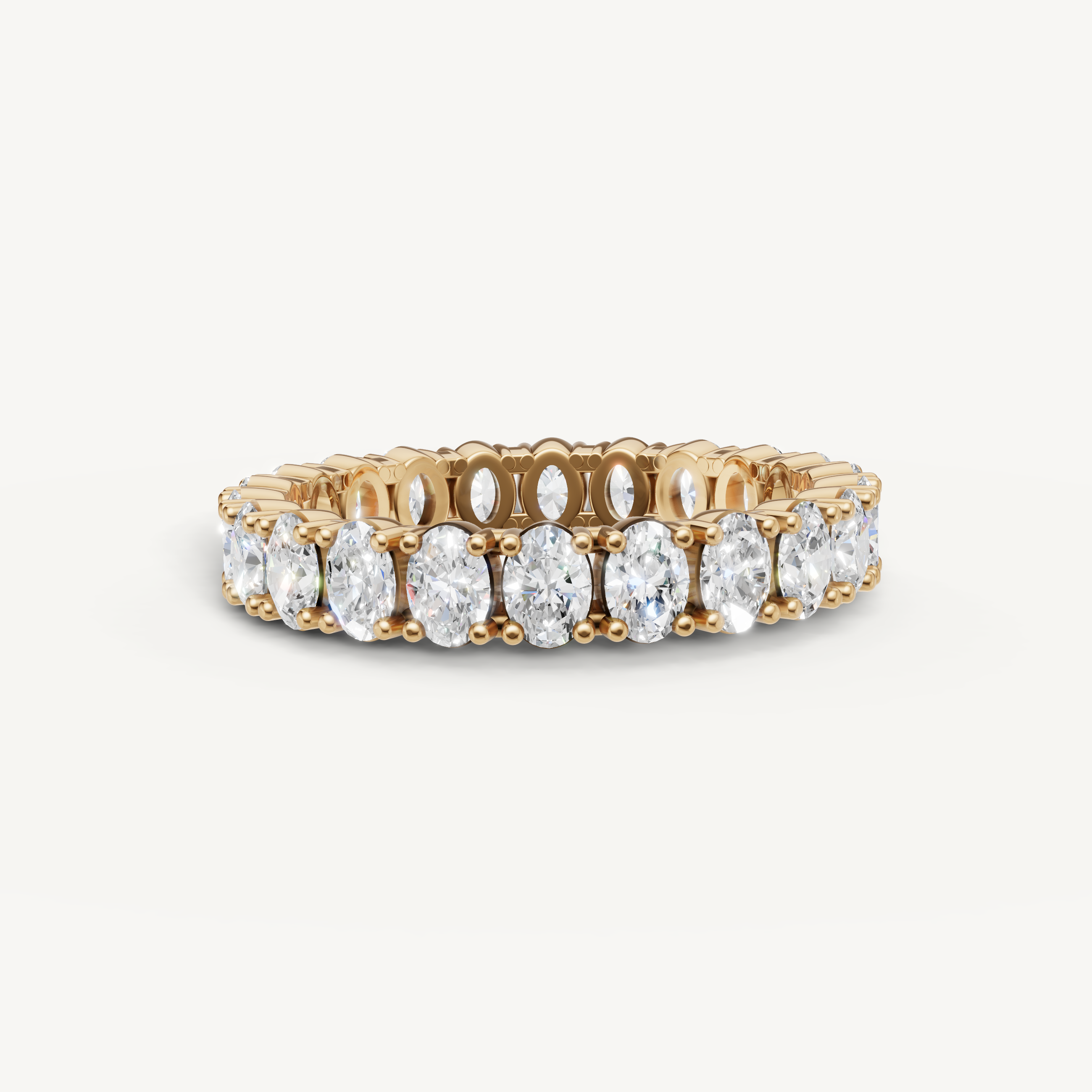 Raul Diamonds yellow gold oval diamond eternity wedding band with brilliant prong setting