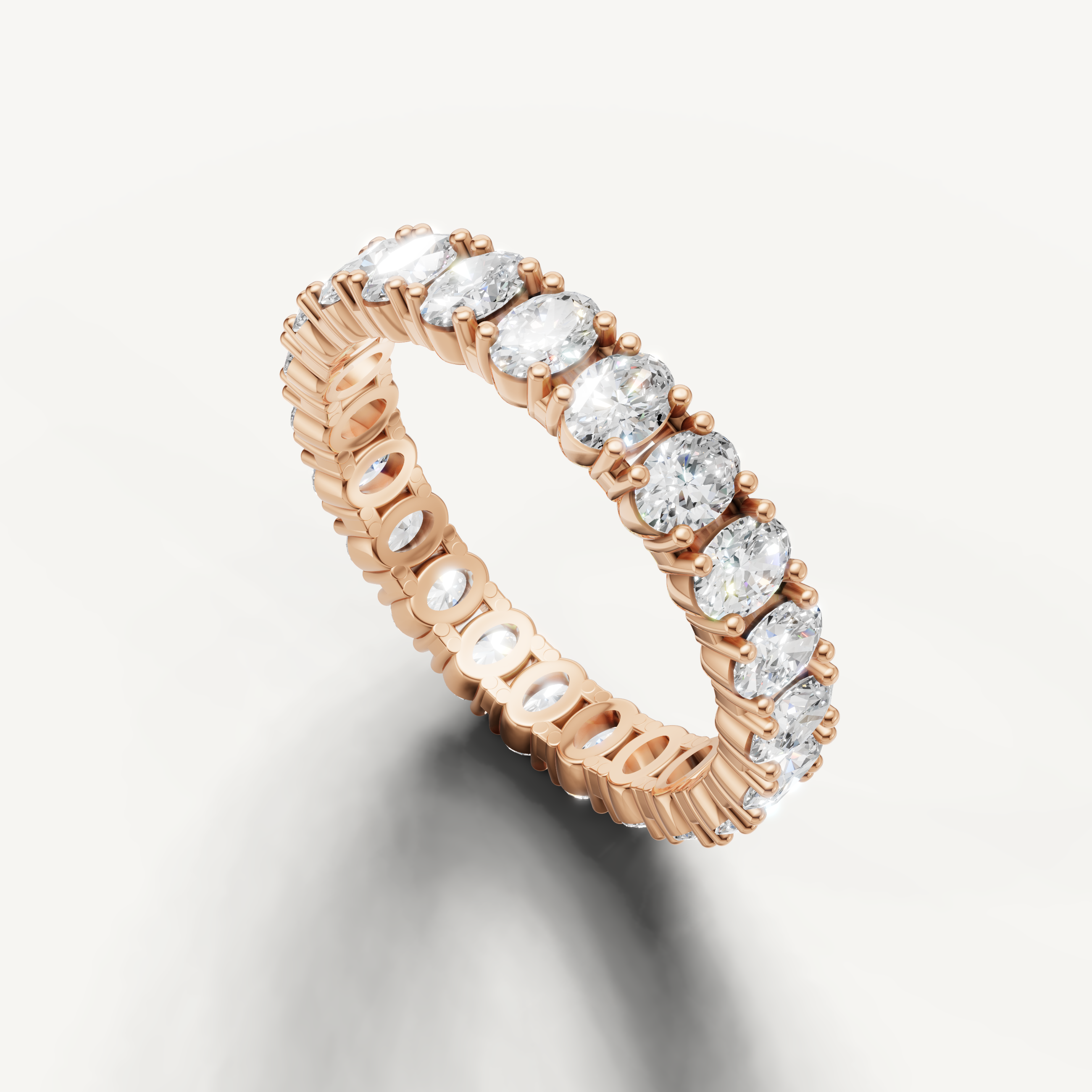 Luxury rose gold eternity wedding band with oval diamonds from Raul Diamonds