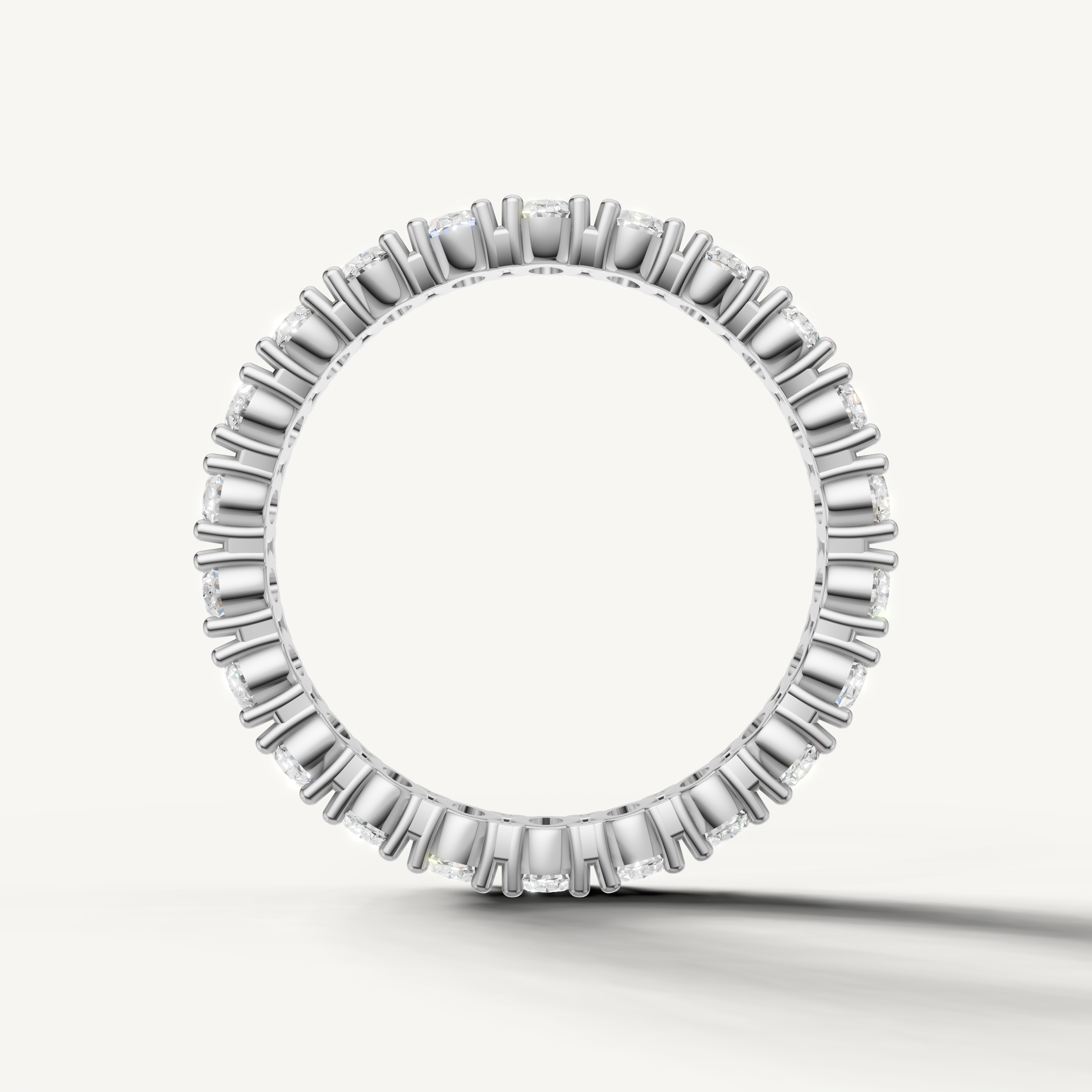 Luxury white gold oval diamond eternity band crafted by Raul Diamonds