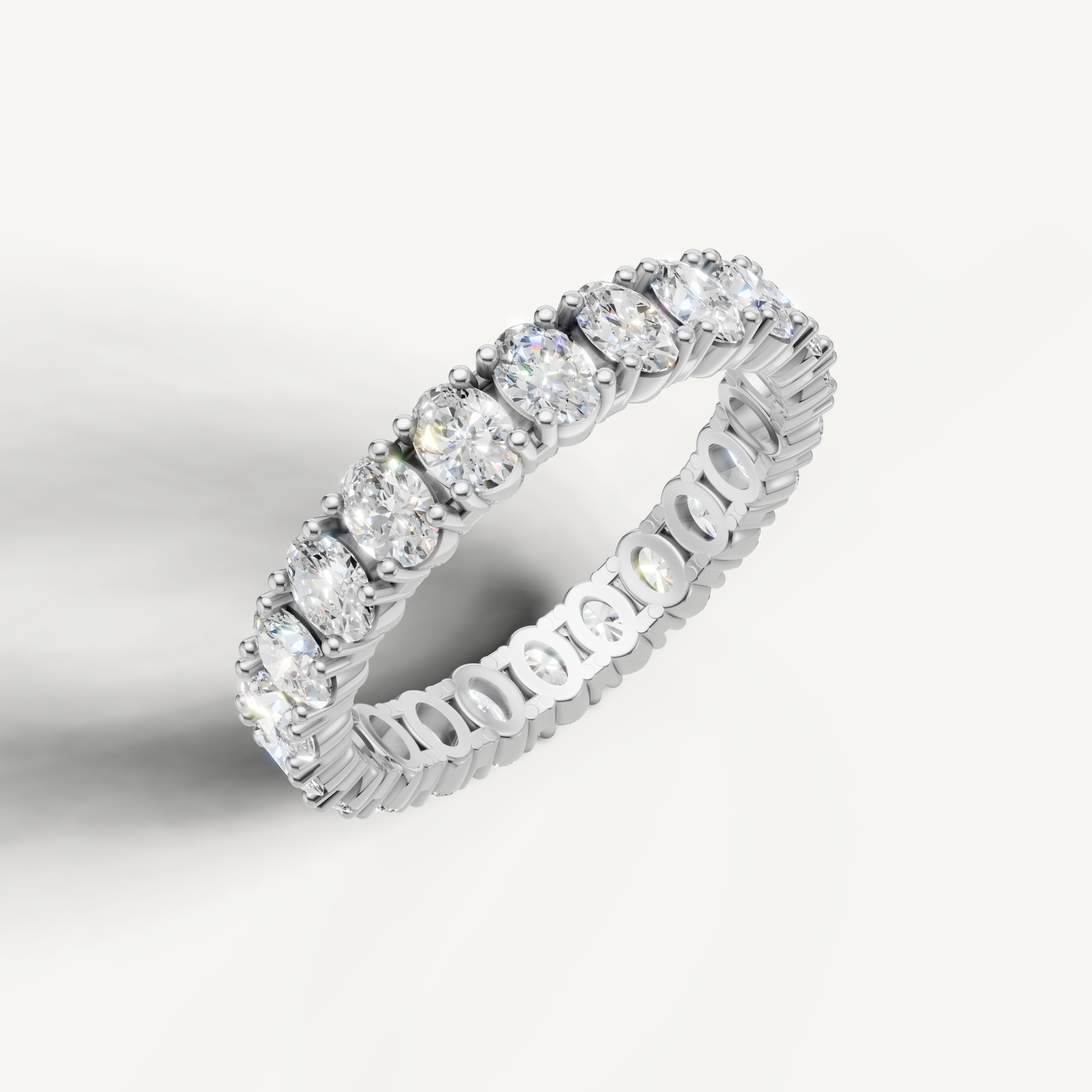 Elegant white gold oval cut diamond wedding band for women by Raul Diamonds