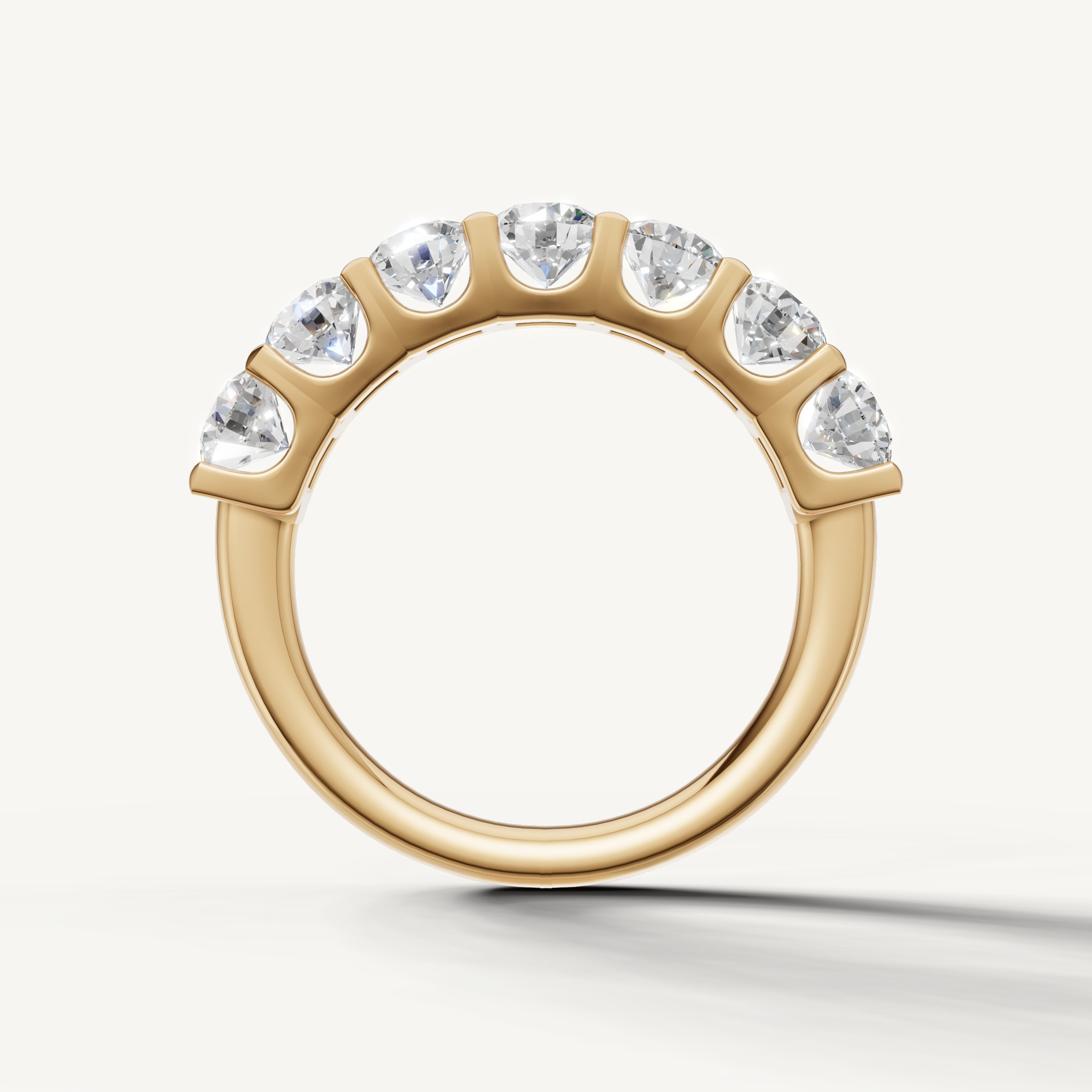 Yellow gold shared prong diamond wedding band for women