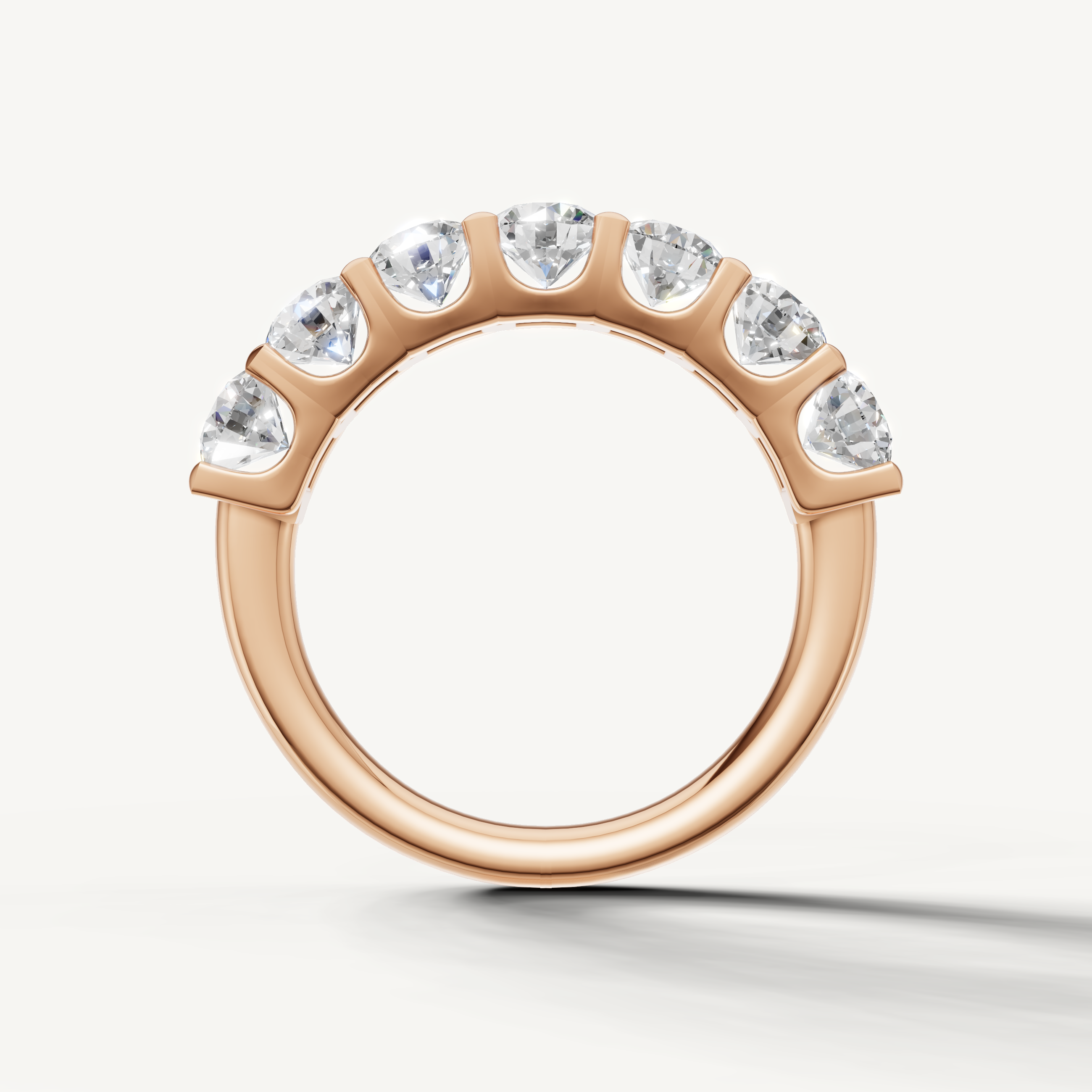 Modern rose gold shared prong diamond eternity band